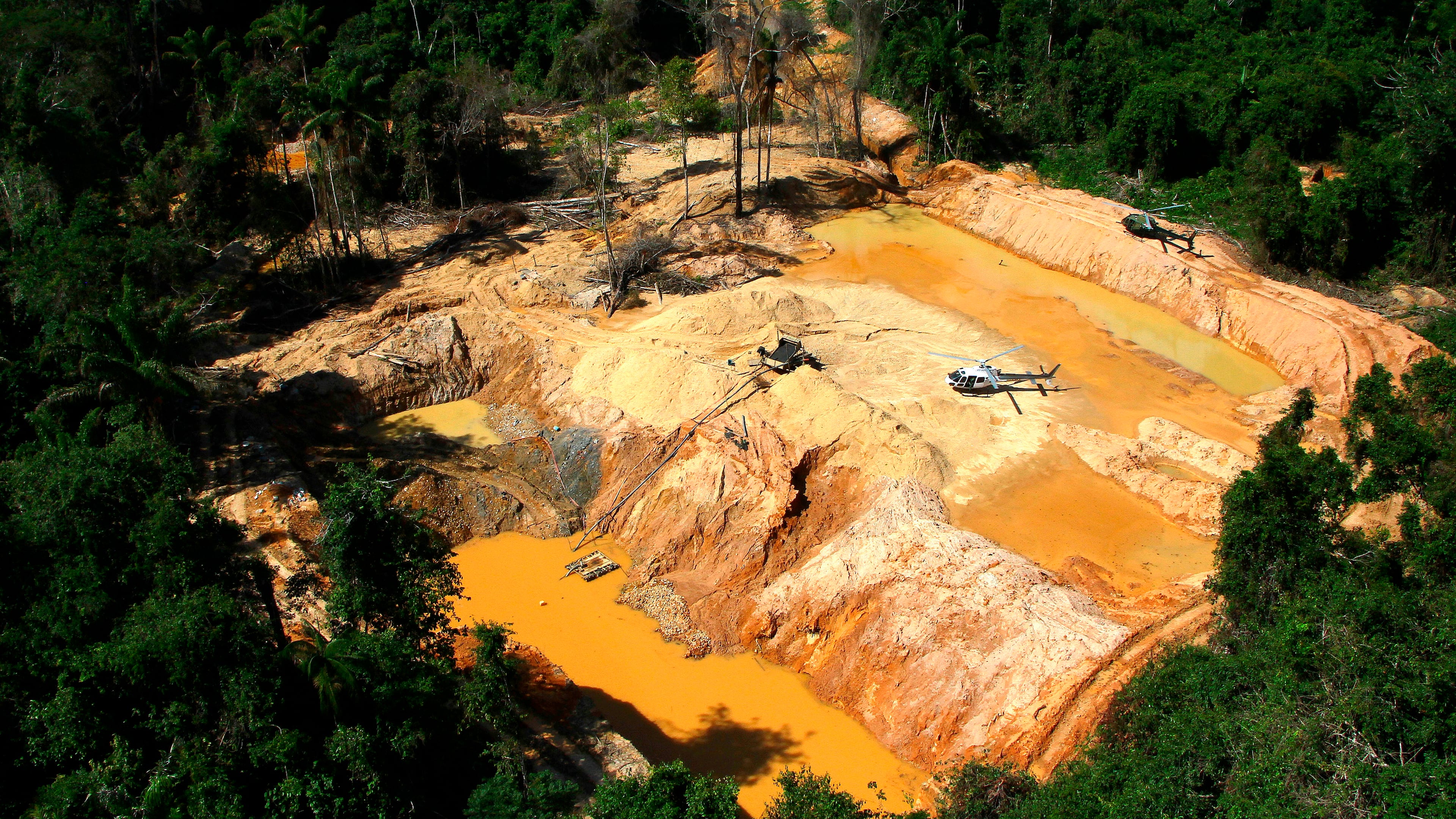 FILE - An illegal mining camp is visible from a Brazil Environmental Agency helicopter during an operation to try to contain illegal mining in Yanomami Indigenous territory, Roraima state, Brazil, Feb. 11, 2023. (AP Photo/Edmar Barros, File)
