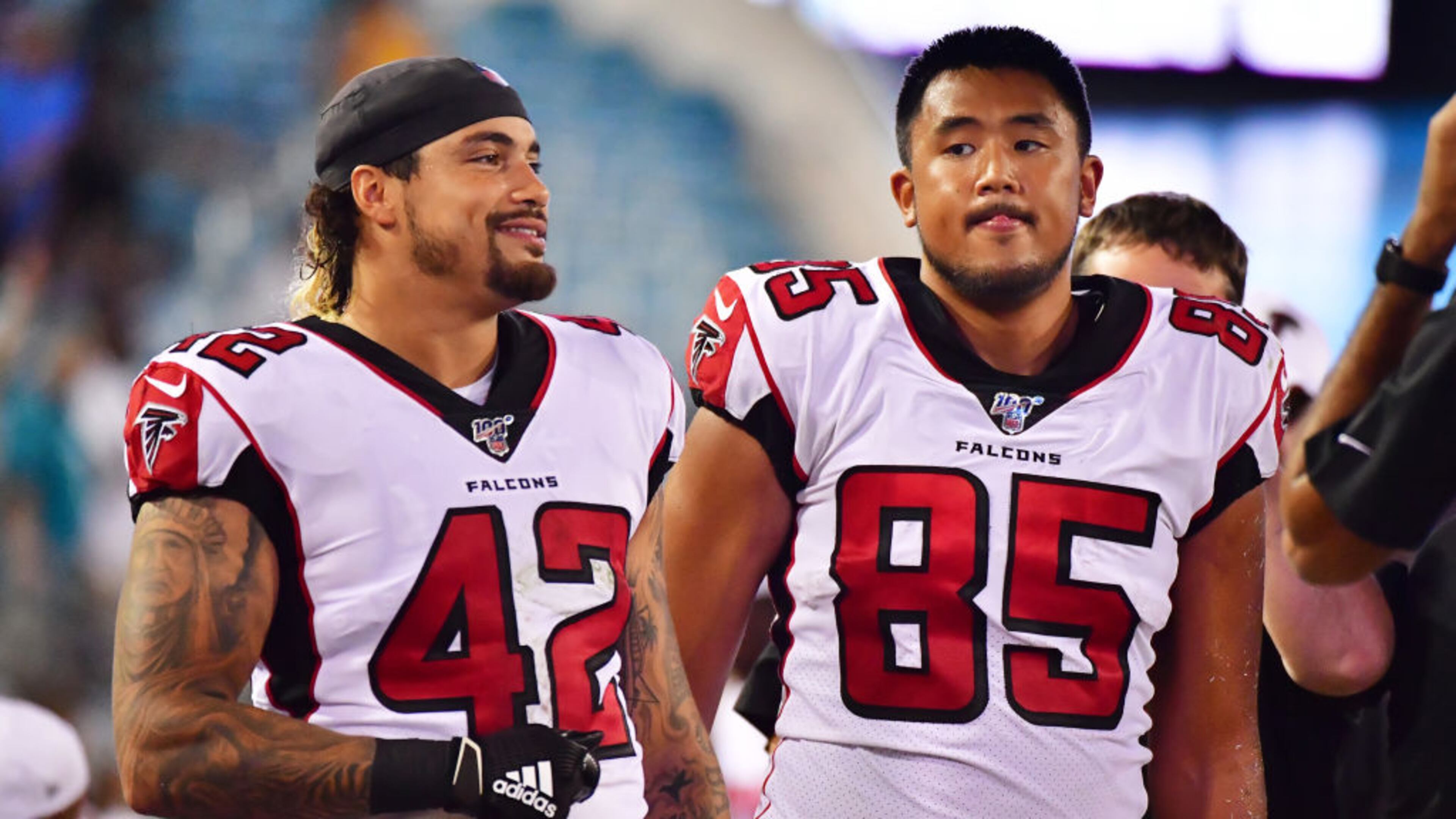 JACKSONVILLE, FLORIDA - AUGUST 29: Duke Riley #42 and Thomas Duarte #85 of the Atlanta Falcons look on during the second half of a preseason football game against the Jacksonville Jaguars at TIAA Bank Field on August 29, 2019 in Jacksonville, Florida. (Photo by Julio Aguilar/Getty Images)