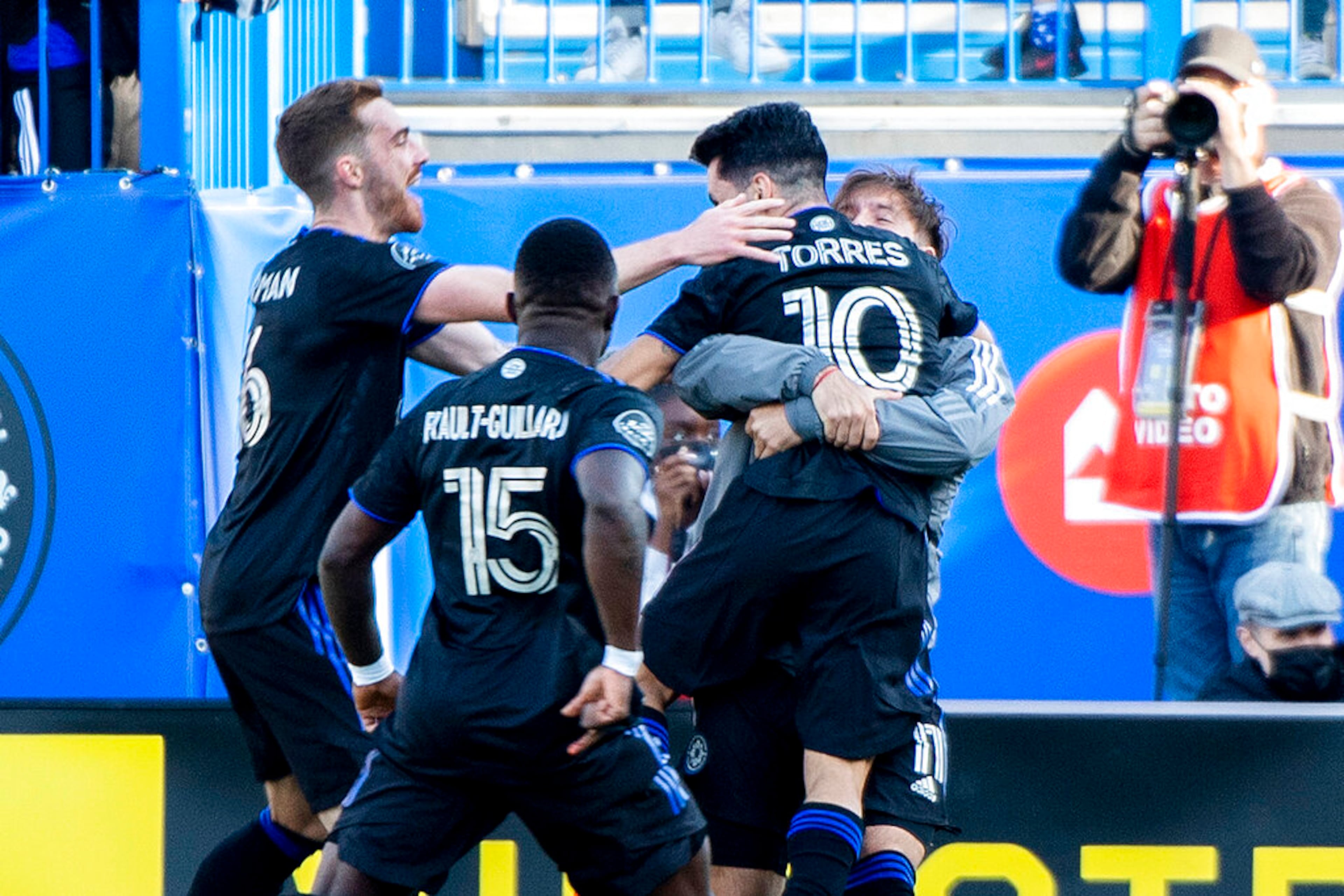 CF Montreal players celebrate a goal by Joaquin Torres (10 during the second half of an MLS soccer game against Atlanta United in Montreal, Saturday, April 30, 2022. (Graham Hughes/The Canadian Press via AP)