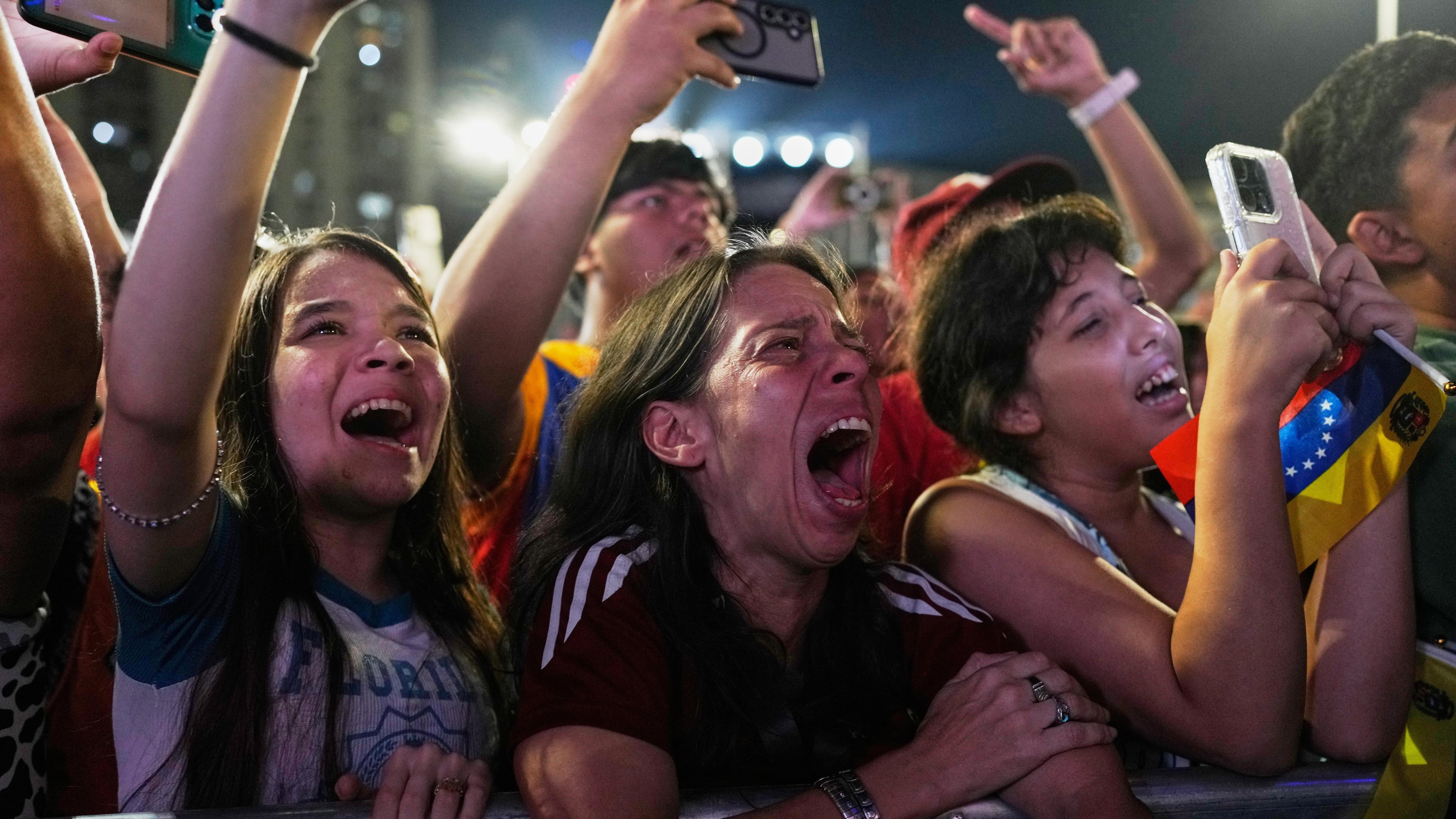Venezuela fans celebrate their country's win against the United States in the championship match of the World Baseball Classic a day prior, in Caracas, Venezuela, Wednesday, March 18, 2026. (AP Photo/Ariana Cubillos)