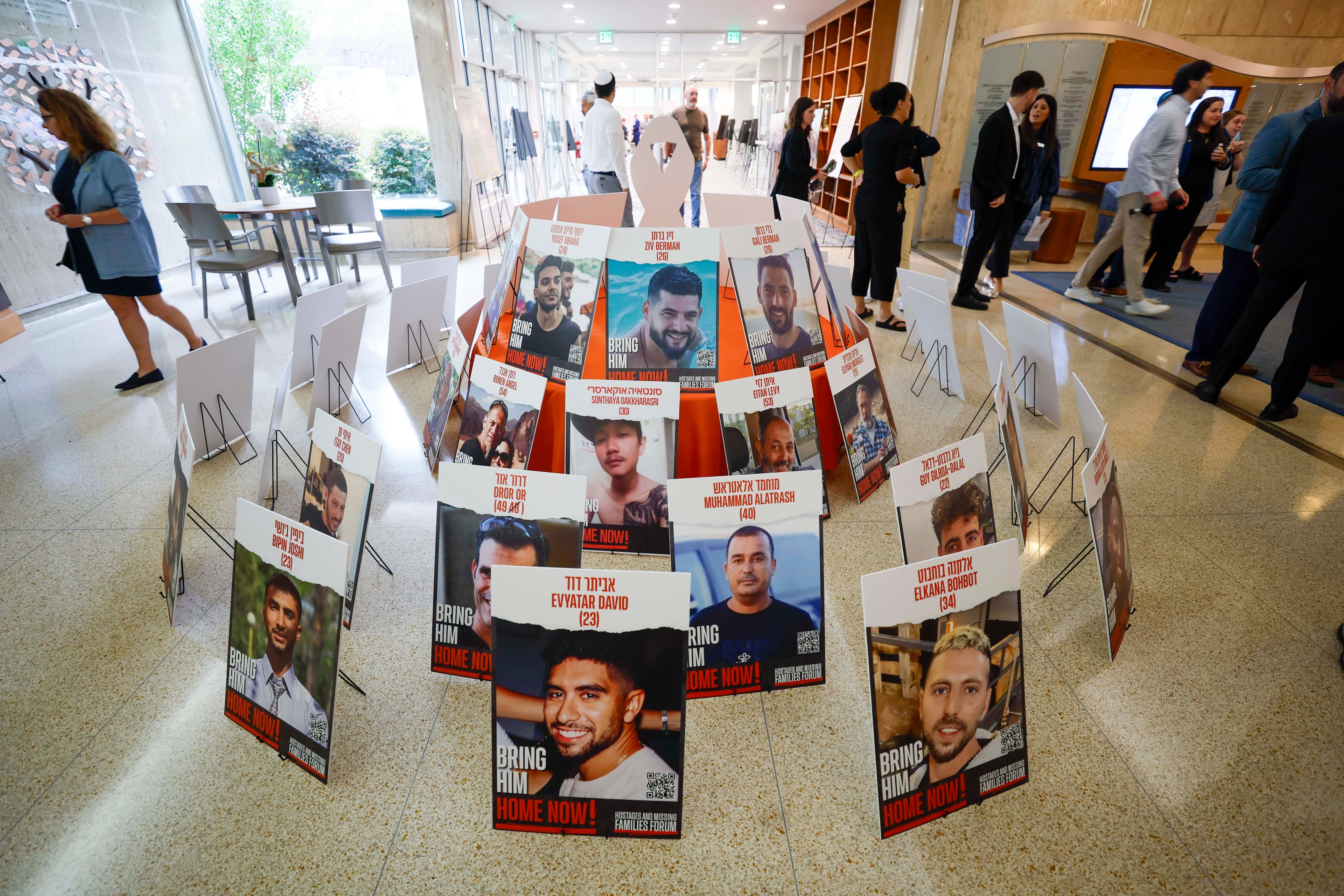 Photographs of hostages are displayed inside the Ahavath Achim Synagogue as members of the Jewish community gather on Sunday, Oct. 5, 2025, to mark the second anniversary of the Oct. 7 attacks. (Miguel Martinez/AJC)