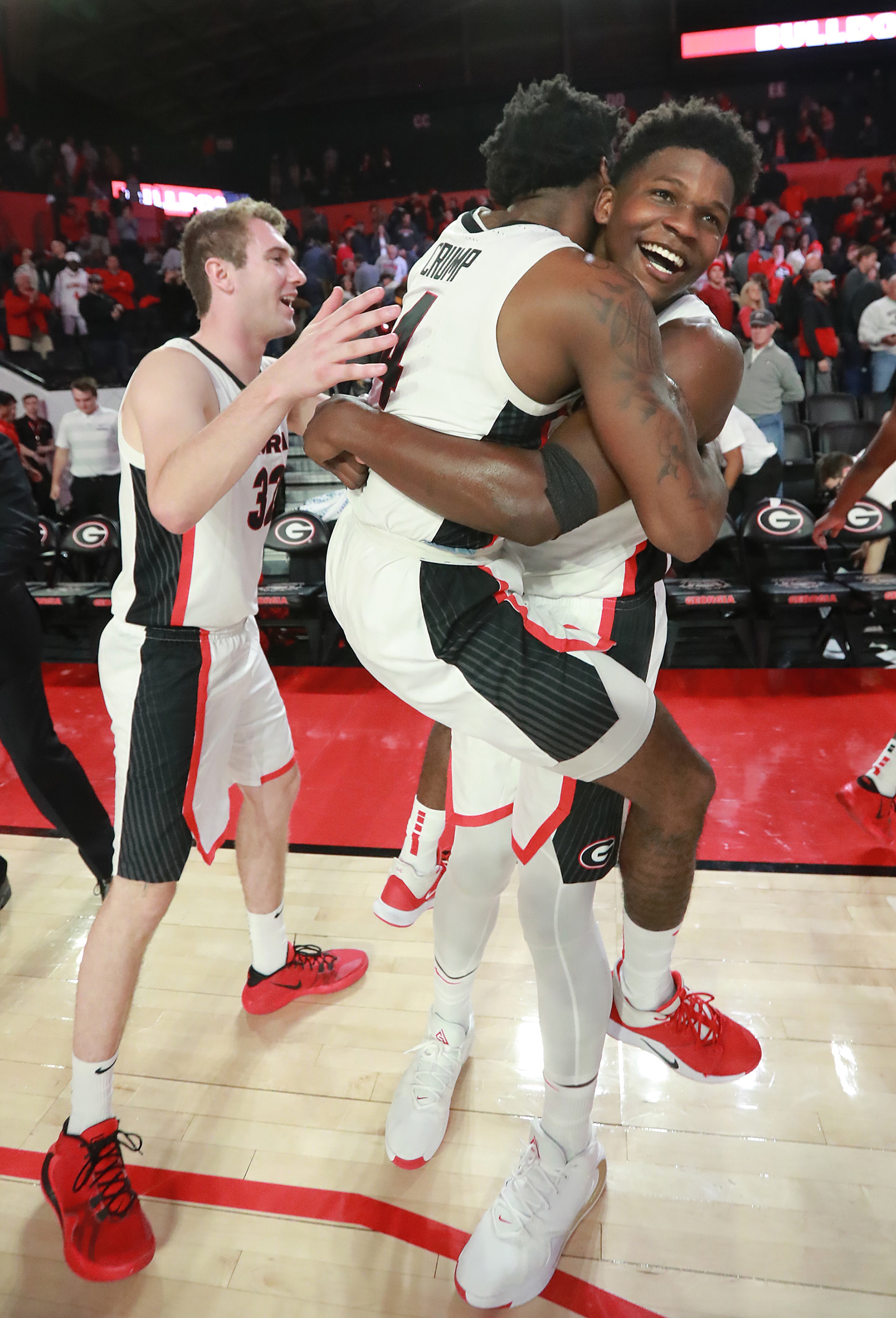 Georgia freshman Anthony Ant-Man Edwards (right) hoists teammate Tyree Crump (center) as they celebrate a 95-86 victory over the Citadel in a NCAA college basketball game on Tuesday, November 12, 2019, in Athens. At left is Stan Turner. Curtis Compton/ccompton@ajc.com