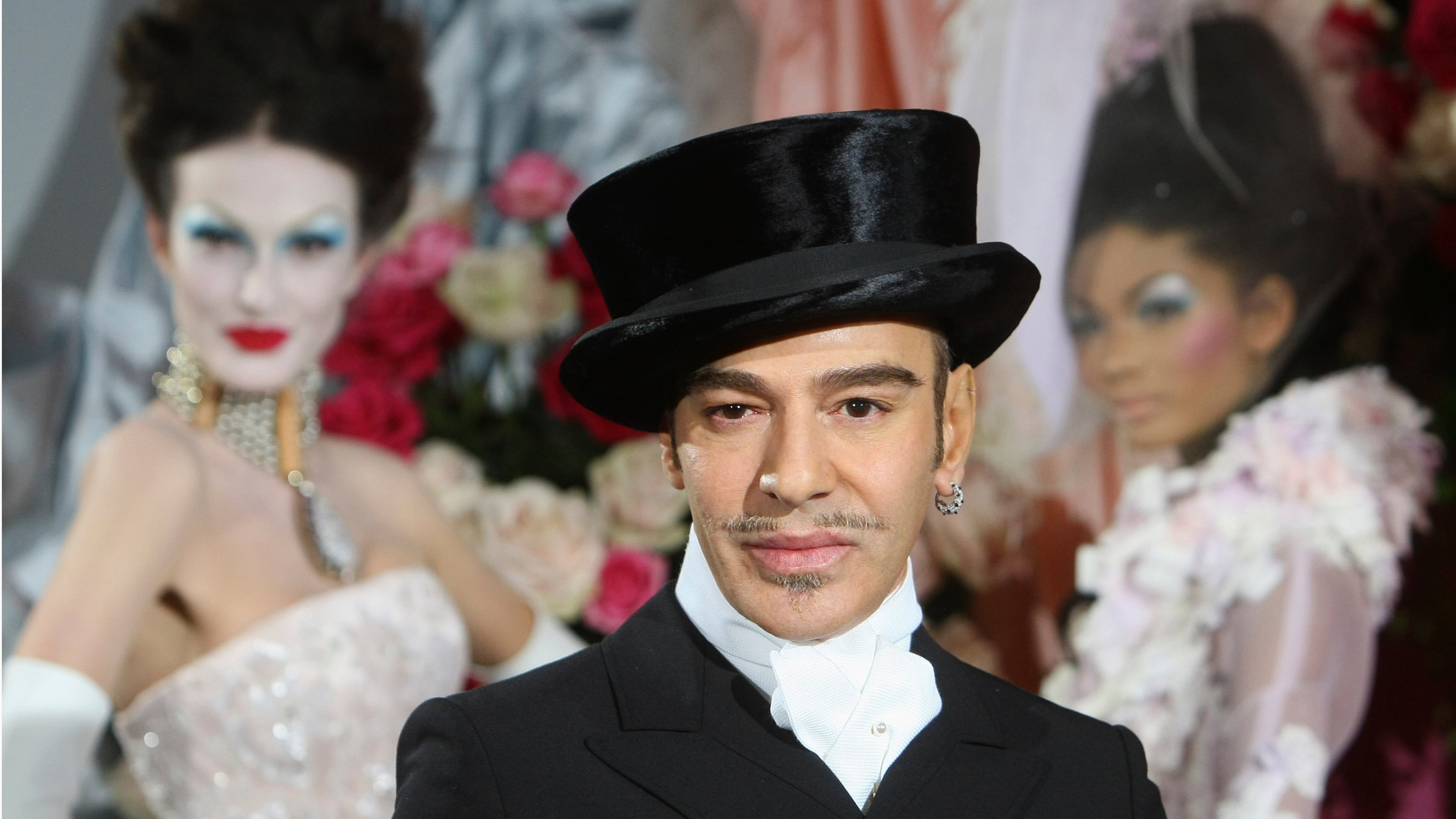 FILE - Fashion designer John Galliano poses at the end of the presentation of the Dior Haute Couture spring/summer 2010 fashion collection on Jan. 25, 2010, in Paris. (AP Photo/Jacques Brinon, File)