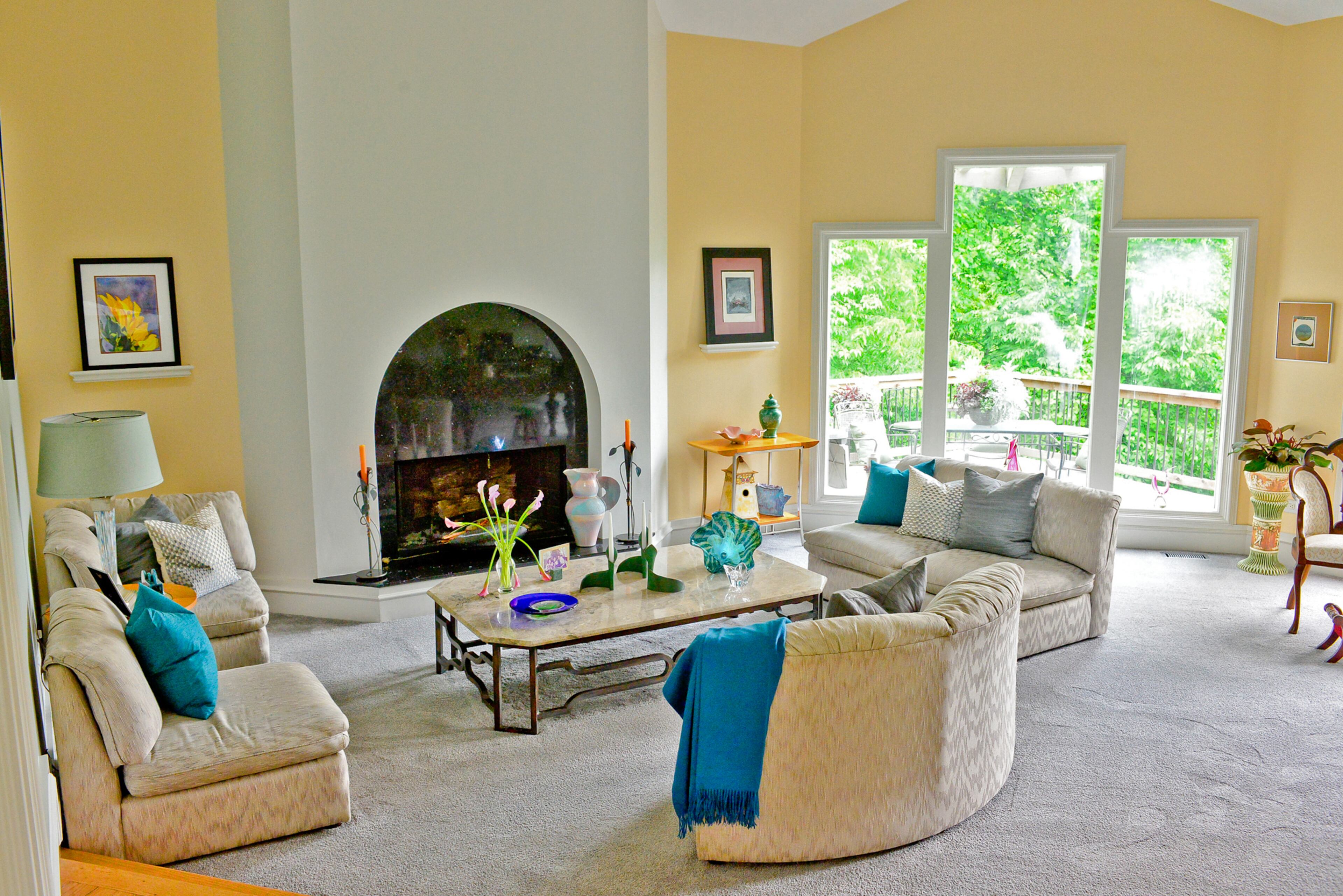 Three fixed windows in the living area highlight the room's rising ceiling and evoke the Art Deco style in this modern Roswell home, owned by professional remodelers Judy Mozen and Randy Urquhart. Judy designed and built the home in 1986 and jokes, "I have to keep updating it all the time."