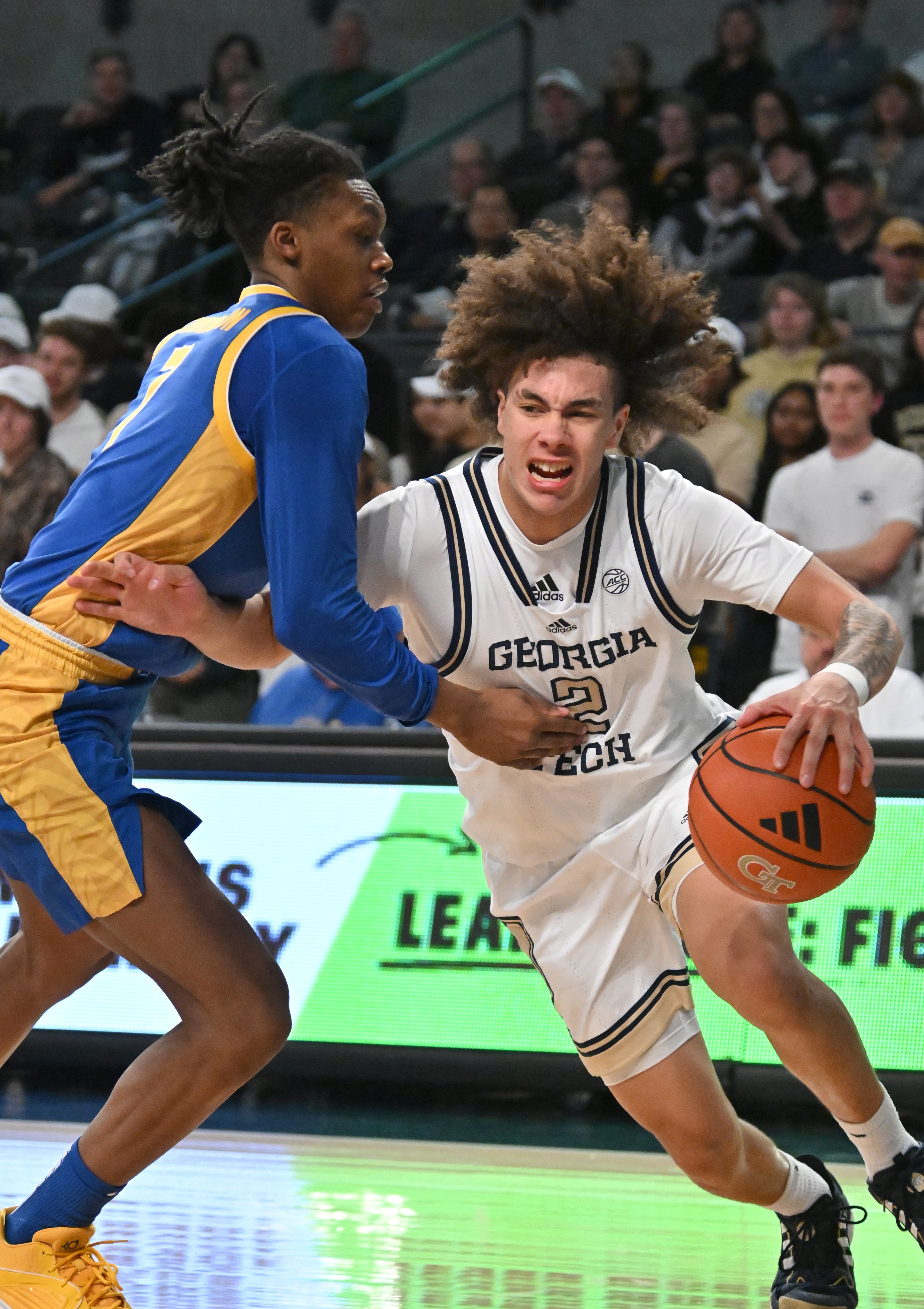 Georgia Tech guard Naithan George (2) drives against Pittsburgh guard Carlton Carrington (7) during the first half of an NCAA college basketball game at Georgia Tech’s McCamish Pavilion, Tuesday, January 23, 2024, in Atlanta. (Hyosub Shin / Hyosub.Shin@ajc.com)