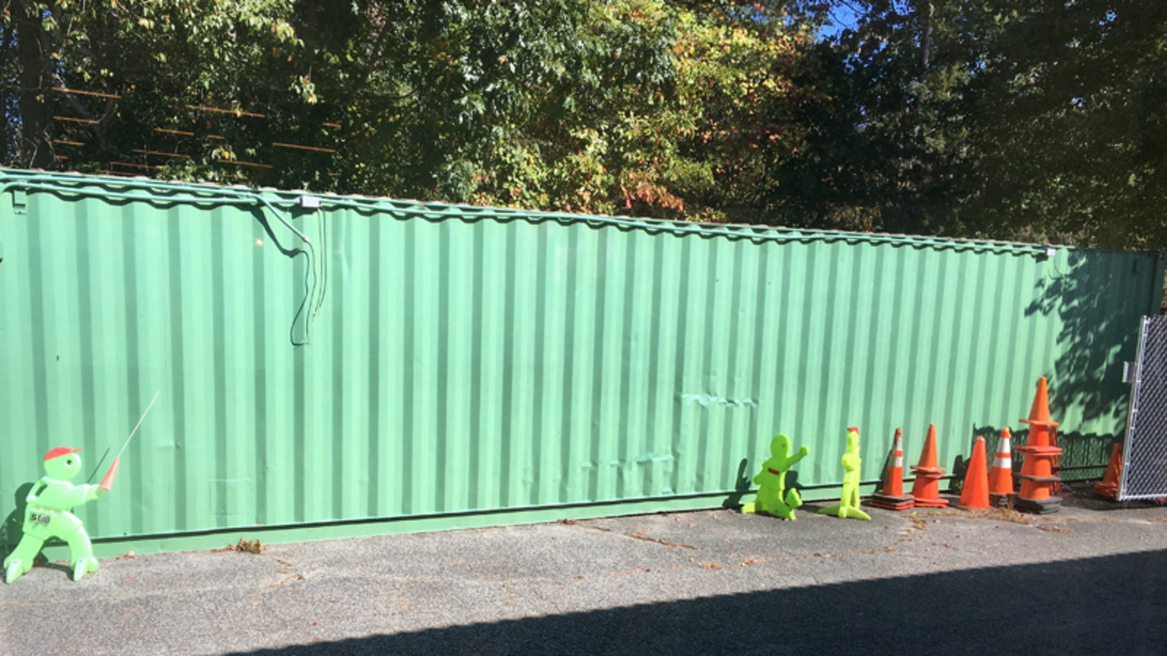 A green storage container next to the North Fulton Community Charities thrift store in Roswell is a potential canvas for an artist willing to donate his or her services to paint a mural on its side.