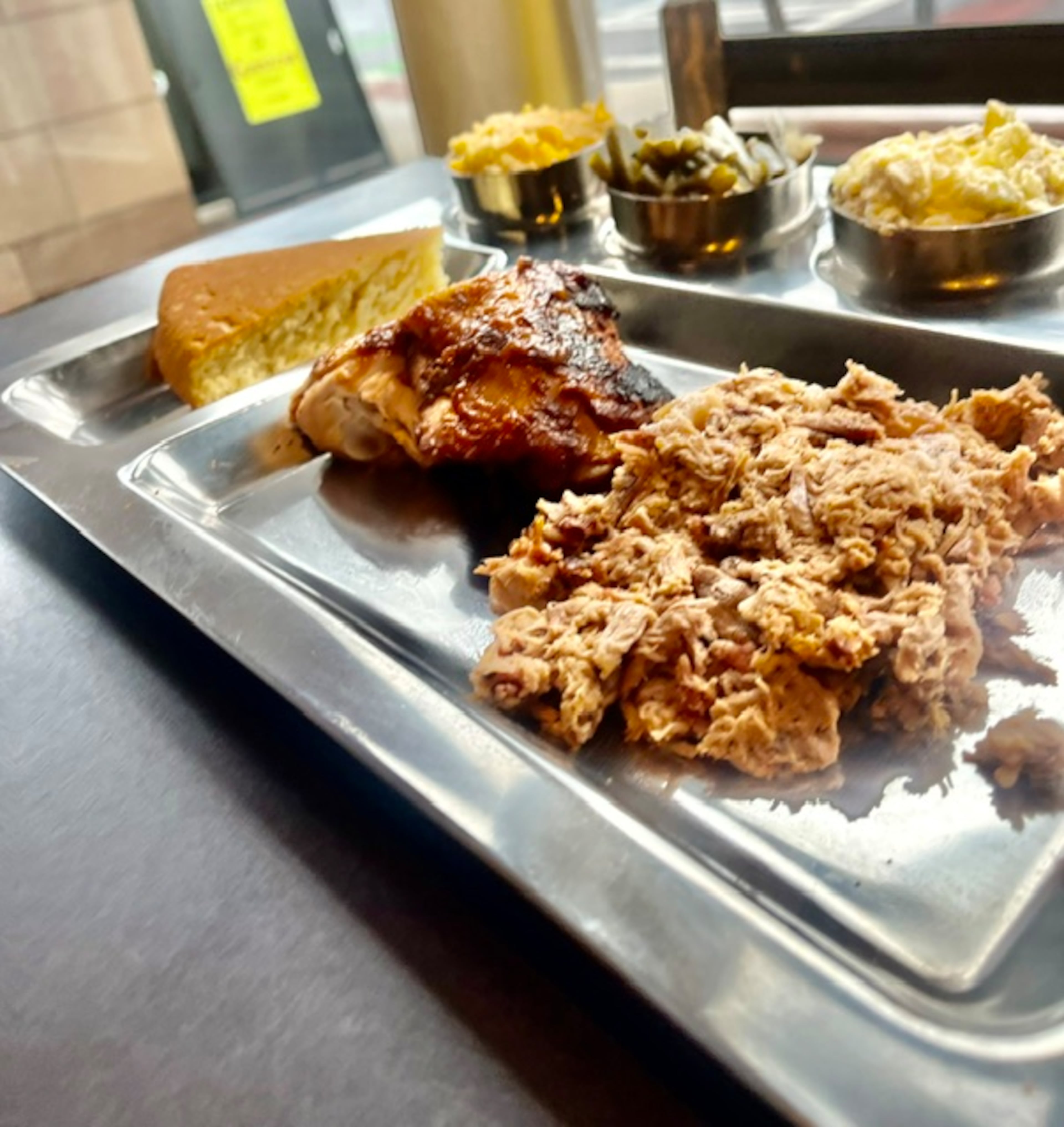 Terminus City BBQ’s chopped pork, barbecue chicken, mac and cheese, potato salad and green beans. (Courtesy of Marco Shaw)