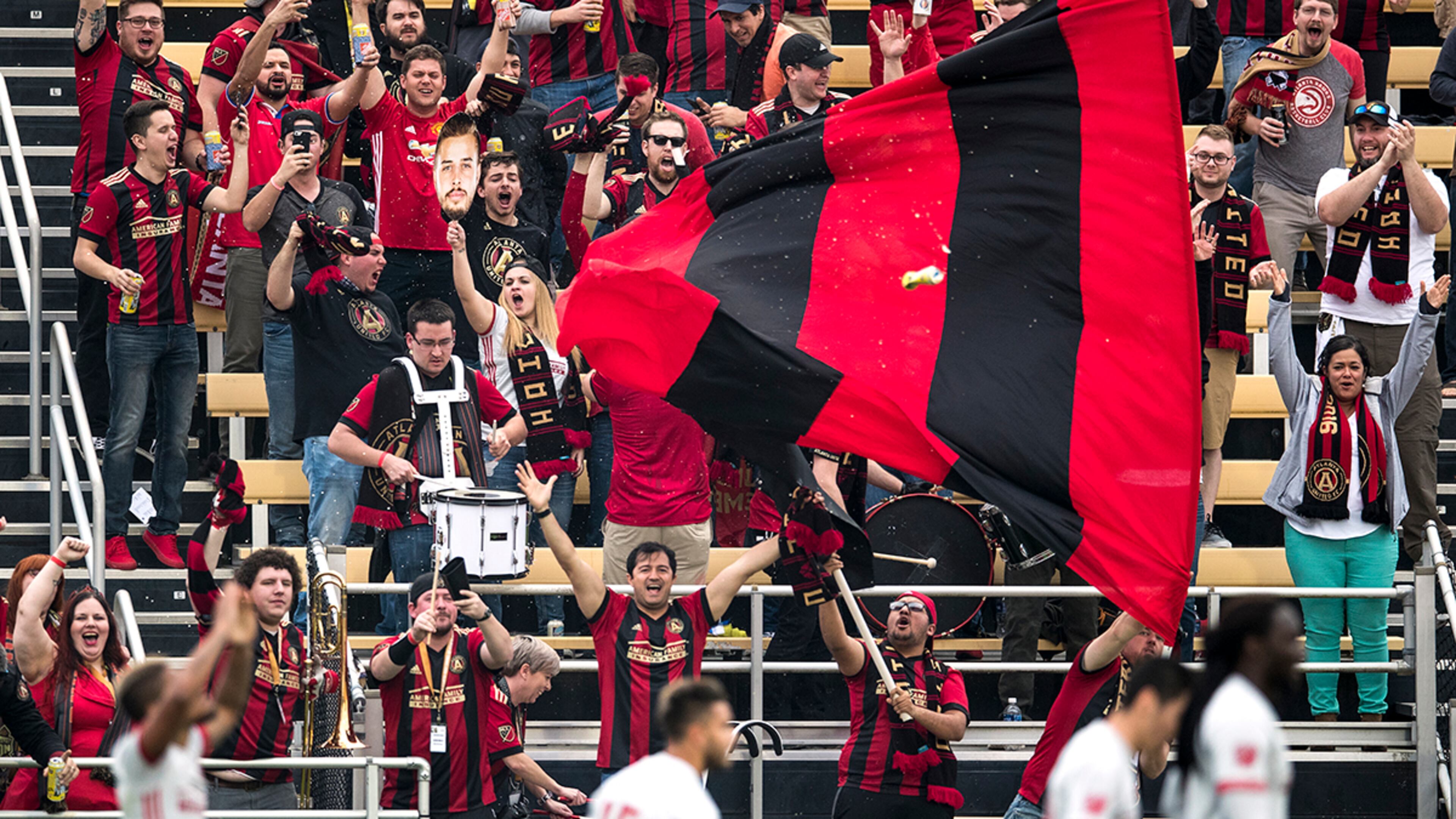 Charleston, South Carolina - February 18, 2017: A beer flies through the air as supporters celebrate their teams first and only goal against the Columbus Crew on Saturday, Feb. 18, 2017 in Charleston. (Photo by Alex Holt)