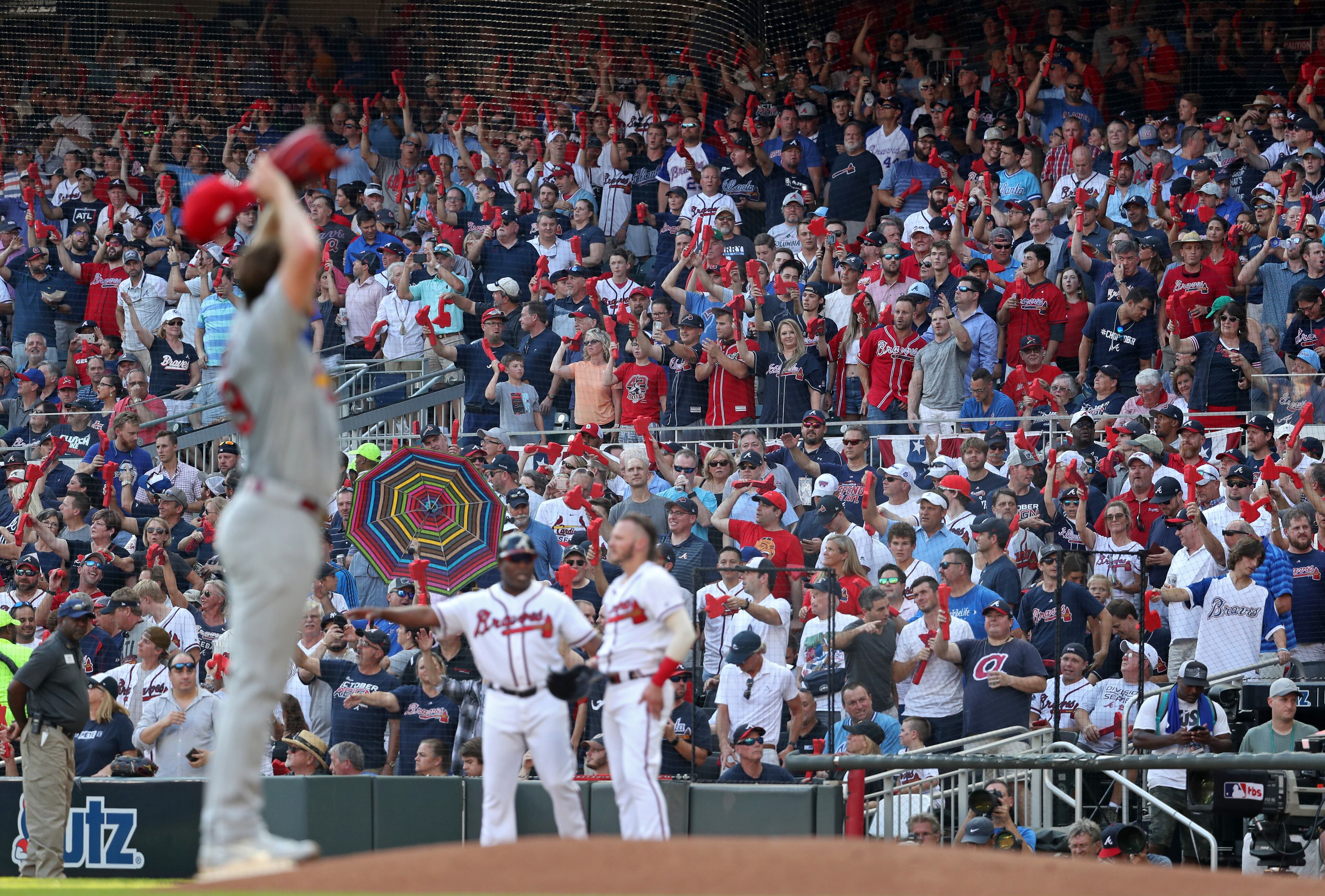 Cardinals starting pitcher Miles Mikolas, left, reacts as Braves fans celebrate after Ozzie Albies (not pictured) scores a run in the first inning. (JASON GETZ/SPECIAL TO THE AJC)
