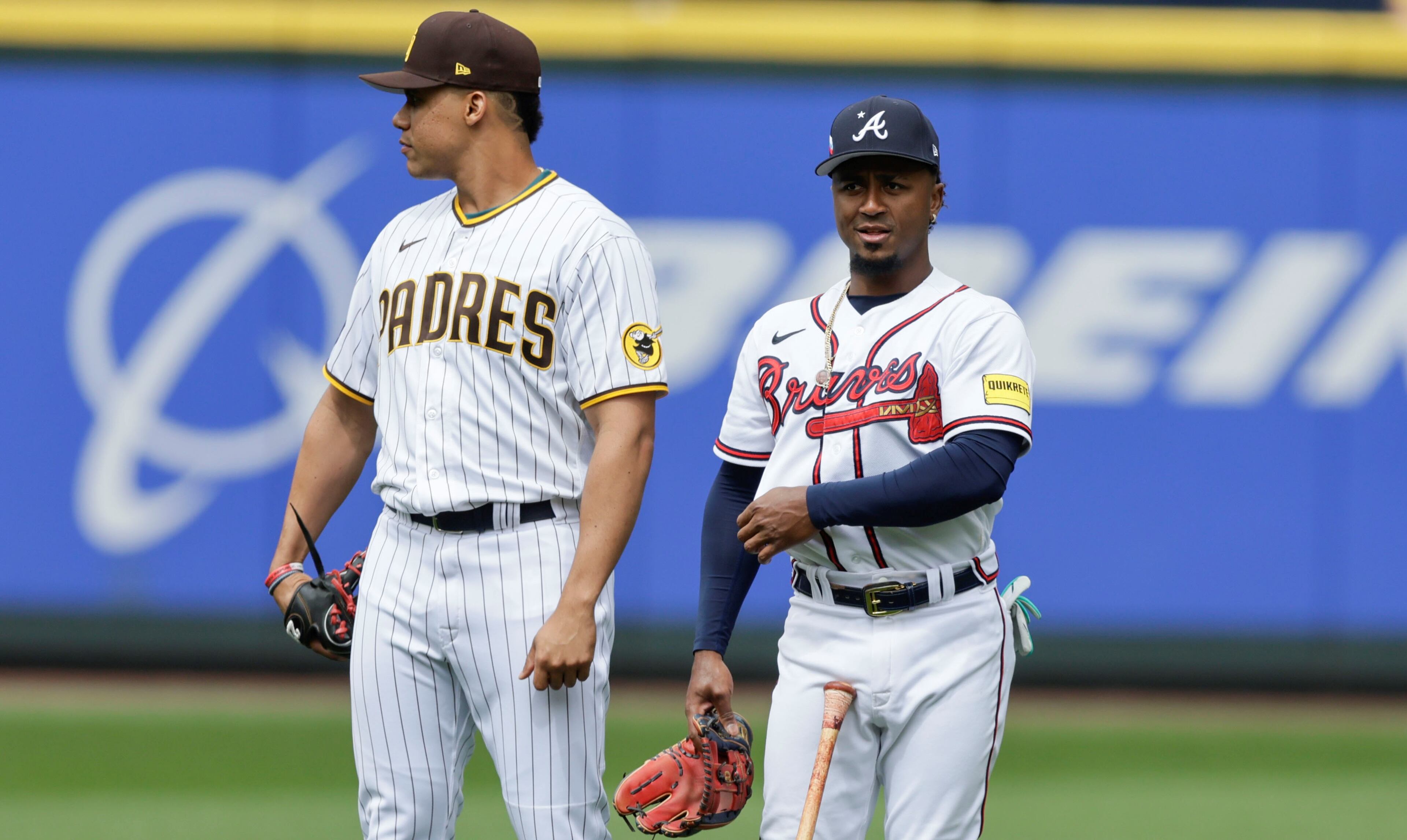Ozzie Albies keeps an eye on the action along with Juan Soto of the Padres during batting practice before the MLB All-Star baseball Home Run Derby in Seattle, Monday, July 10, 2023. (AP Photo/John Froschauer)