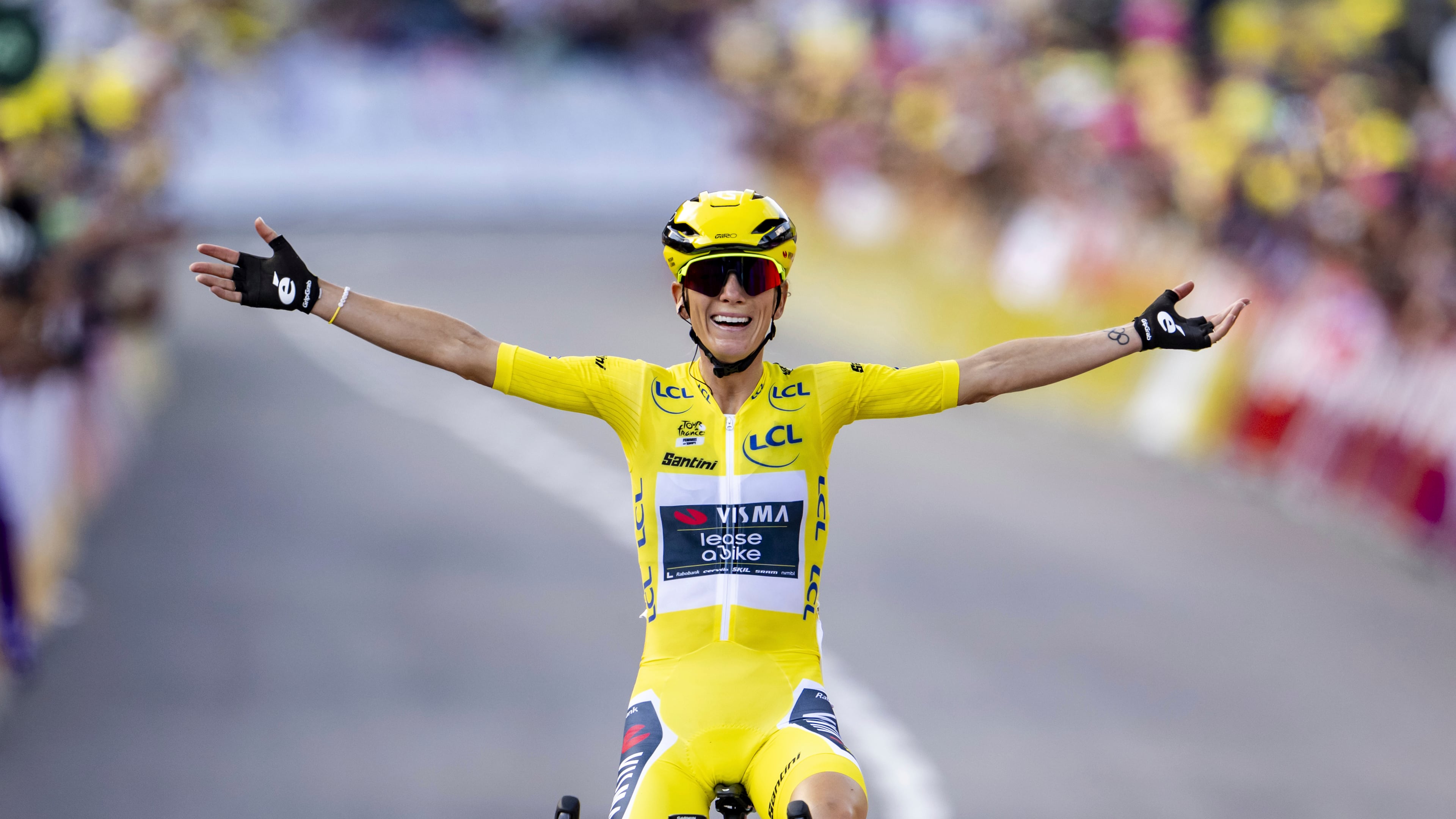 FILE - The winner of the Tour de France Femmes Pauline Ferrand-Prevot from France of team Visma - Lease a Bike celebrates as she crosses the finish line to win the 9th stage of the 4th edition of the Women's Tour de France cycling race in Chatel, France, Aug. 3, 2025. (Jean-Christophe Bott/Keystone via AP, File)