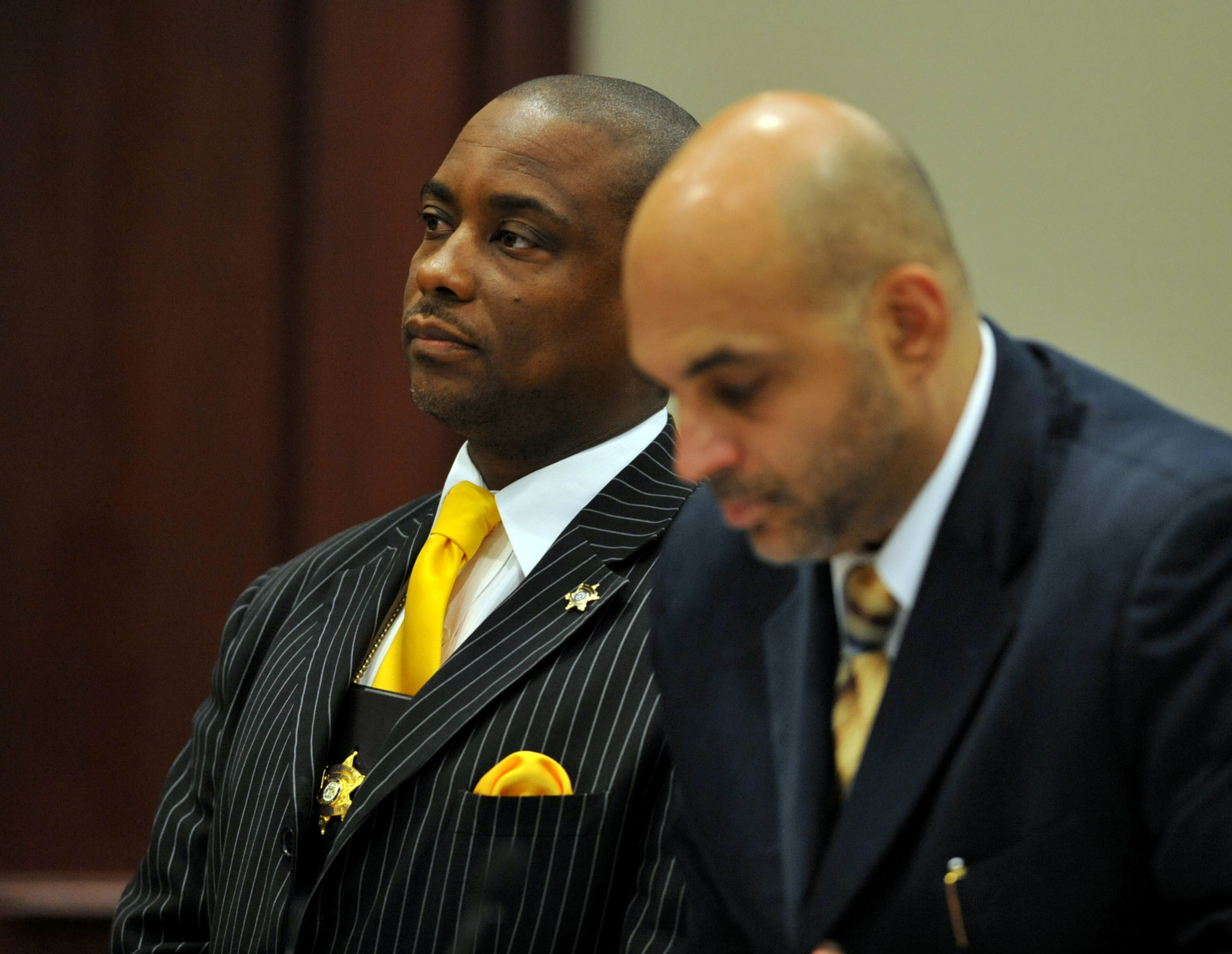 JUNE 21, 2013 JONESBORO Clayton County Sheriff Victor Hill stands next to one of his defense attorneys, Musa Ghanayem, as Clayton County Superior Court Judge Albert Collier presides over a hearing in the case against Clayton County Sheriff Victor Hill Friday June 21, 2013. Judge Collier set August 5, m2013 as the start of the trial with 350 potential jurors to show up on that date. He also denied a defense motion to force Clayton County District Attorney Tracy Graham Lawson to recuse herself from prosecuting the case. She had not officially recused herself although she has asked Alchovy DA Layla Zon to be the state's lead prosecutor on the case. KENT D. JOHNSON/KDJOHNSON@AJC.COM