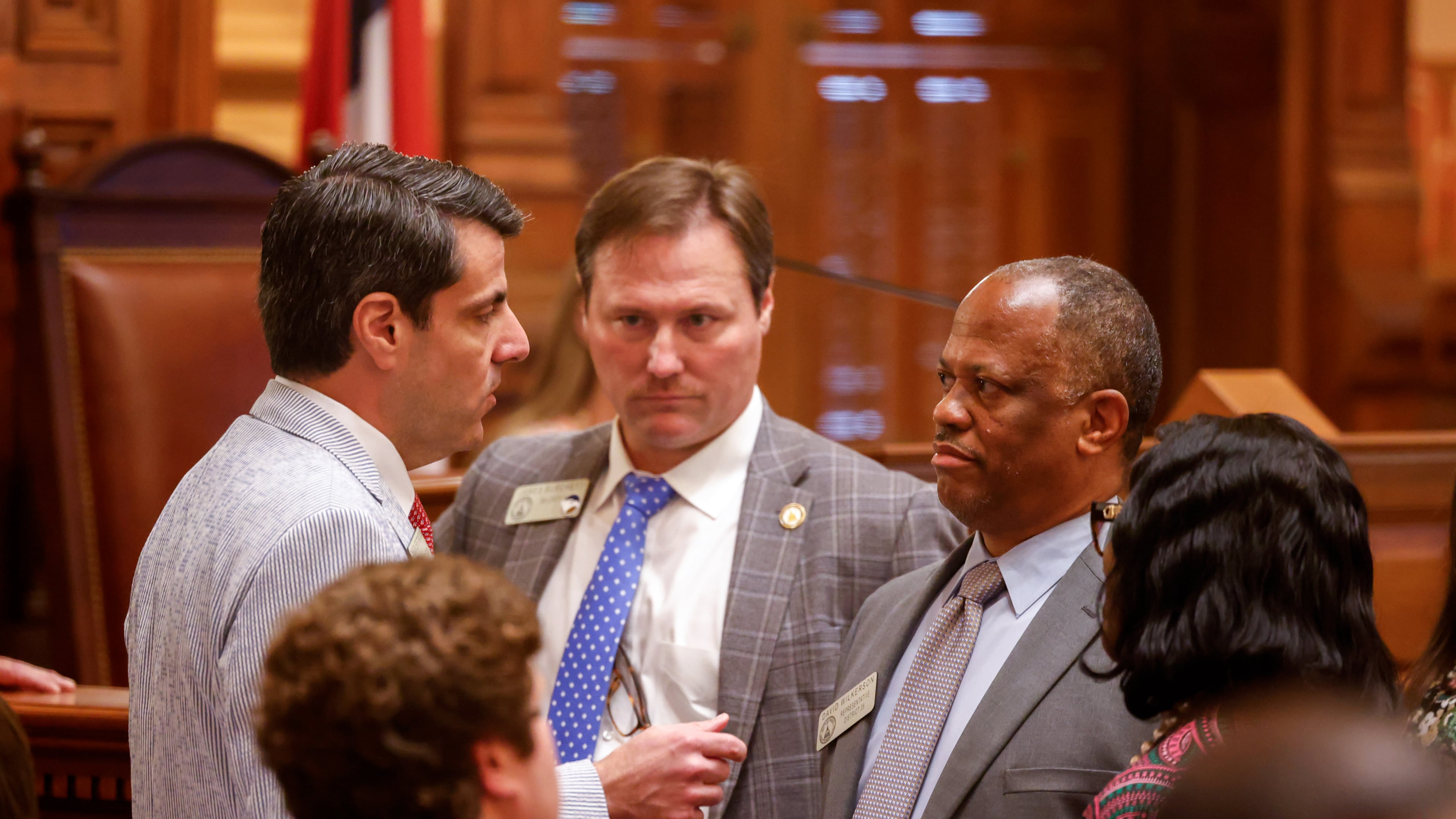 State Rep. Chuck Efstration, left, R-Mulberry, and Rep. David Wilkerson, right, D-Powder Springs, confer before a vote on property tax legislation during the special session in the House of Representatives at the Capitol in Atlanta. (Arvin Temkar/AJC)