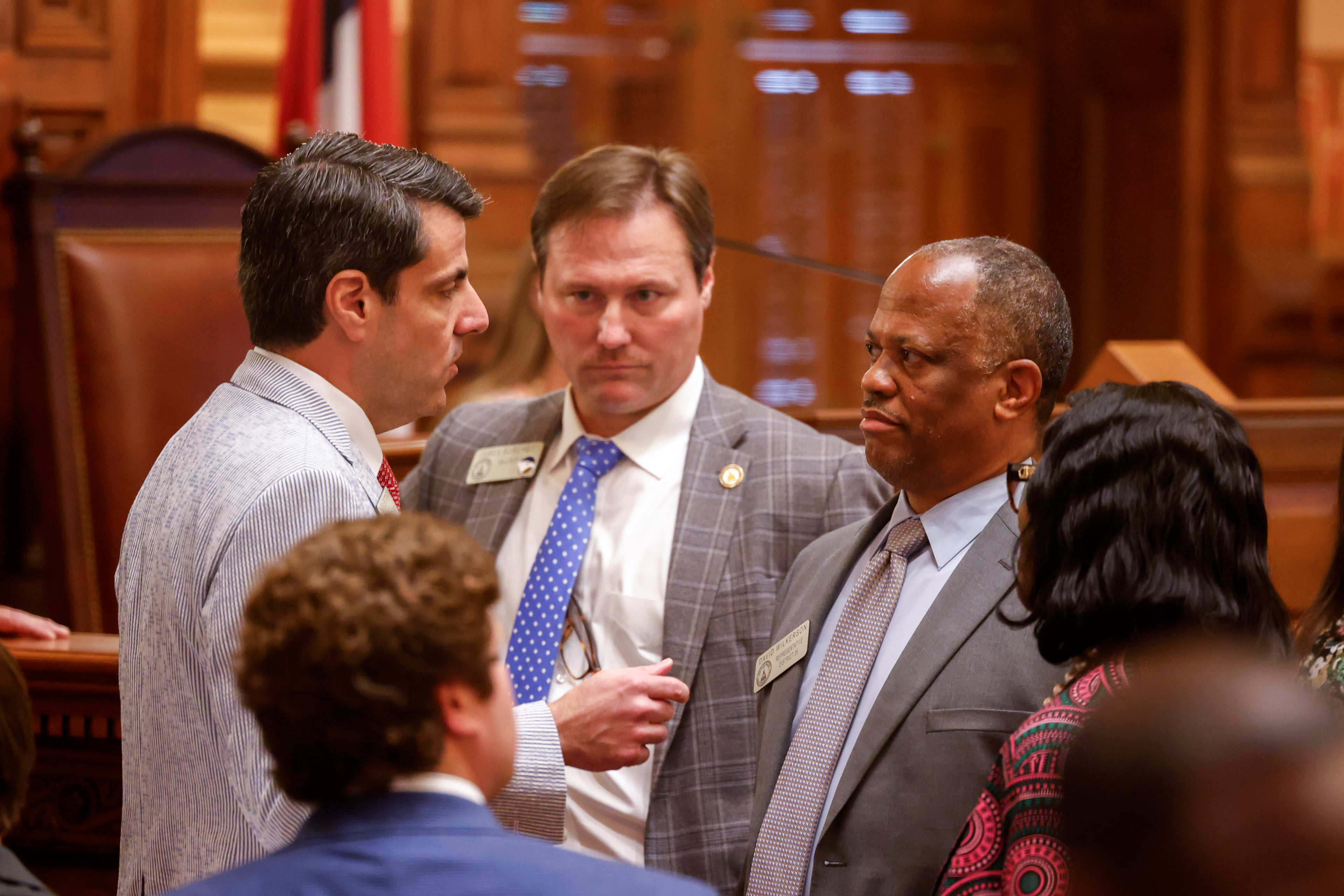 State Rep. Chuck Efstration, left, R-Mulberry, and Rep. David Wilkerson, right, D-Powder Springs, confer before a vote on property tax legislation during the special session in the House of Representatives at the Capitol in Atlanta. (Arvin Temkar/AJC)