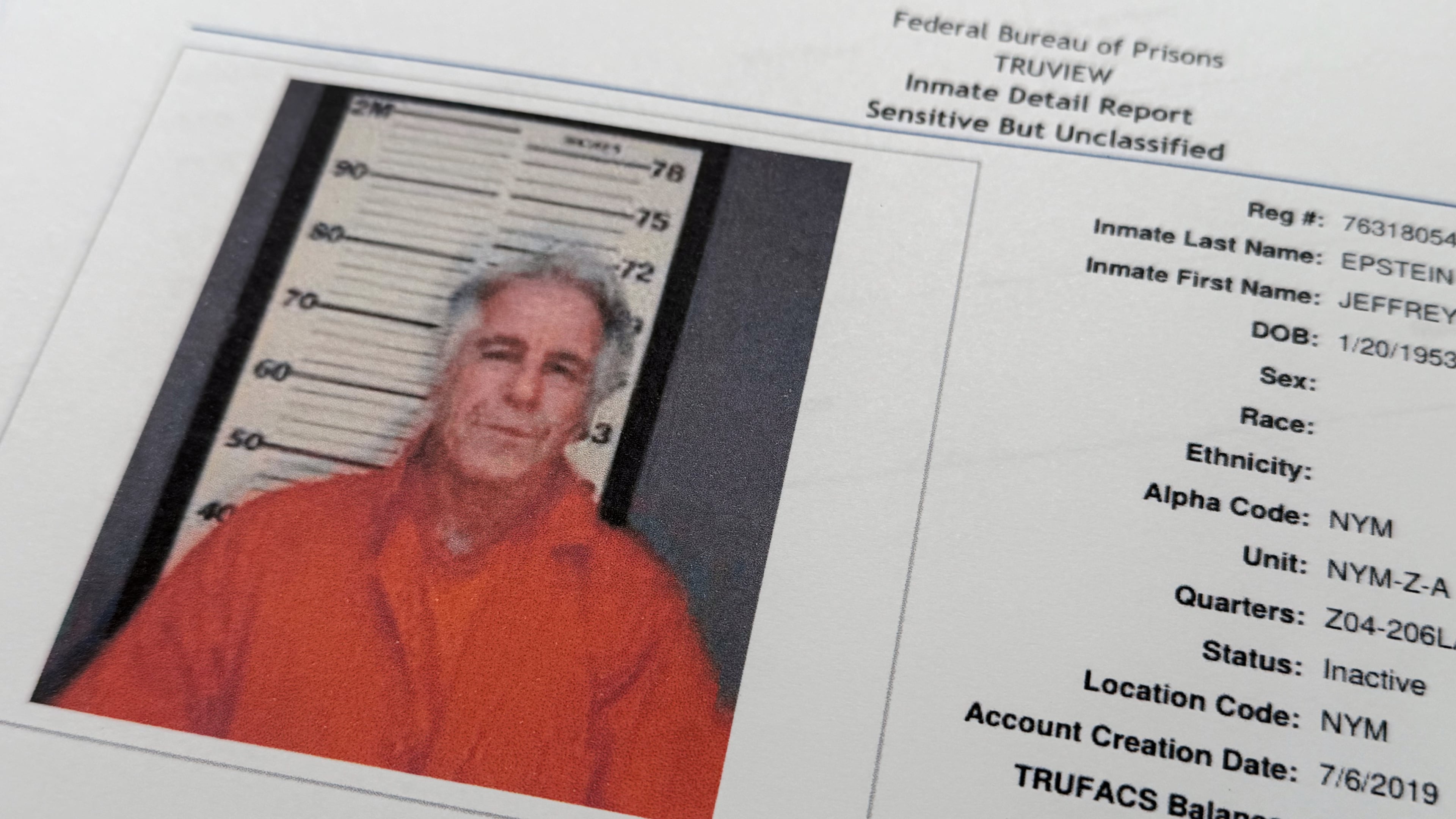 A document that was included in the U.S. Department of Justice release of the Jeffrey Epstein files, photographed Tuesday, Feb. 10, 2026, shows a photo of Epstein on a inmate report from the Federal Bureau of Prisons . (AP Photo/Jon Elswick)
