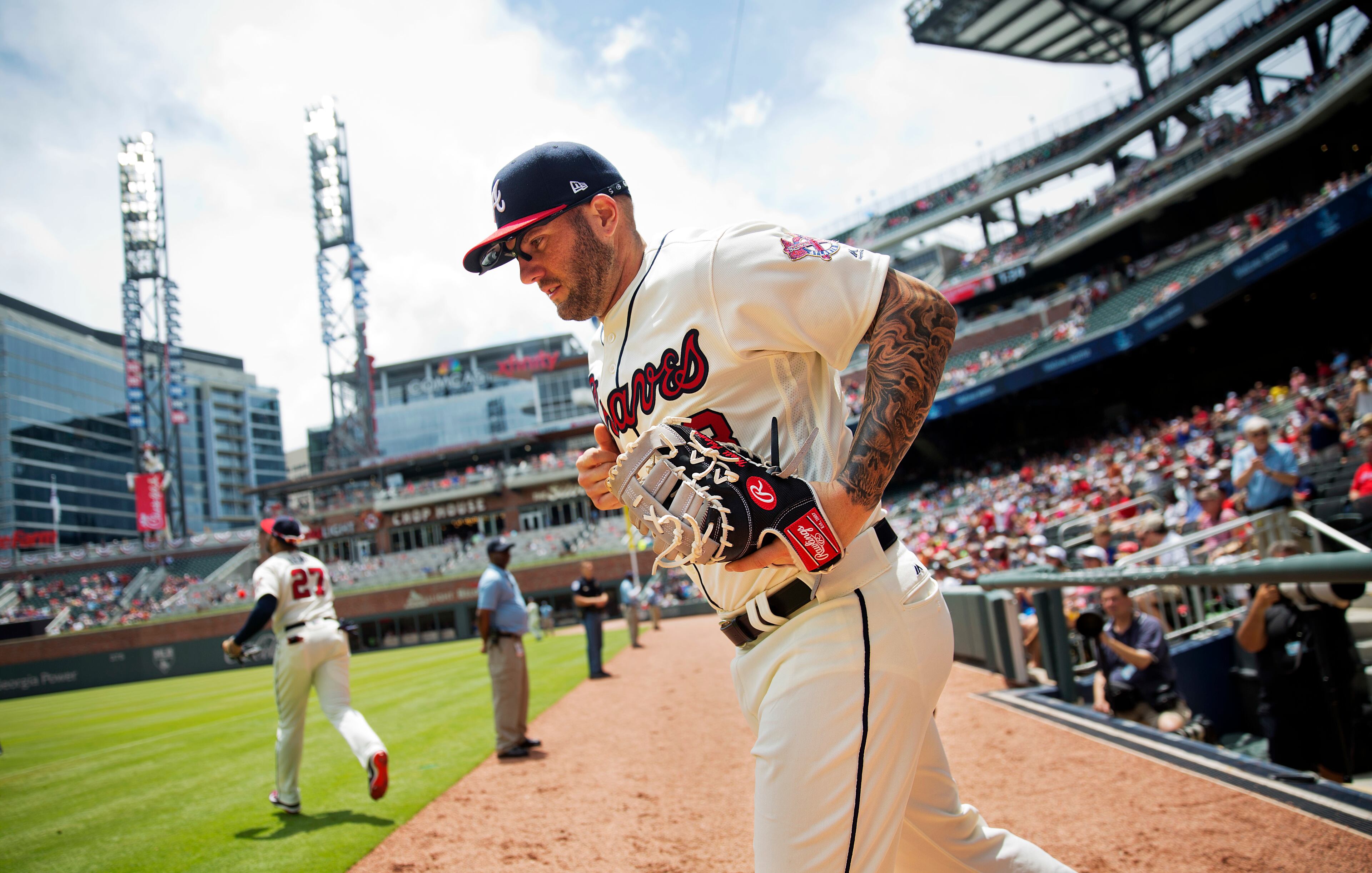 Matt Adams takes the field for Sunday's game against the Nationals.