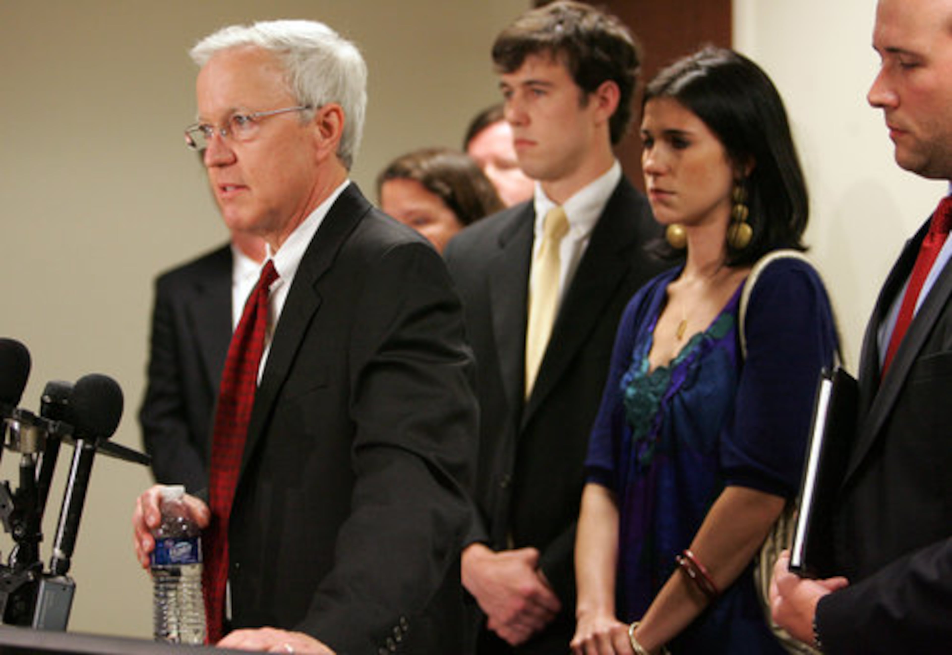 With his children behind him, Jennifer Ewing's husband, Jim Ewing, speaks to the media after a Paulding County jury sentenced Michael Ledford to death in his wife's murder.