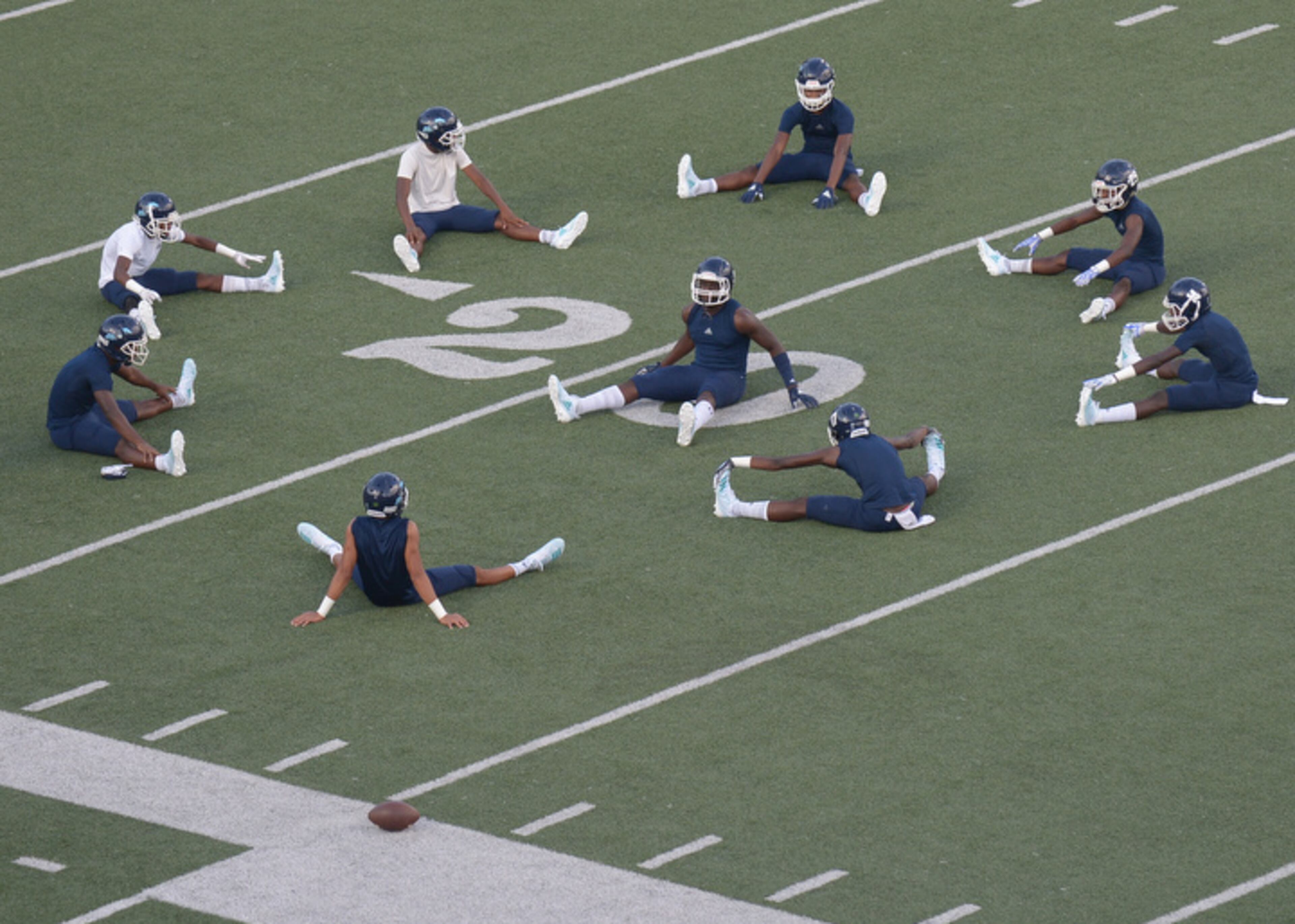 High School football: The Cedar Grove Saints warm up before Friday's game at McEachern. (Daniel Varnado/Special)