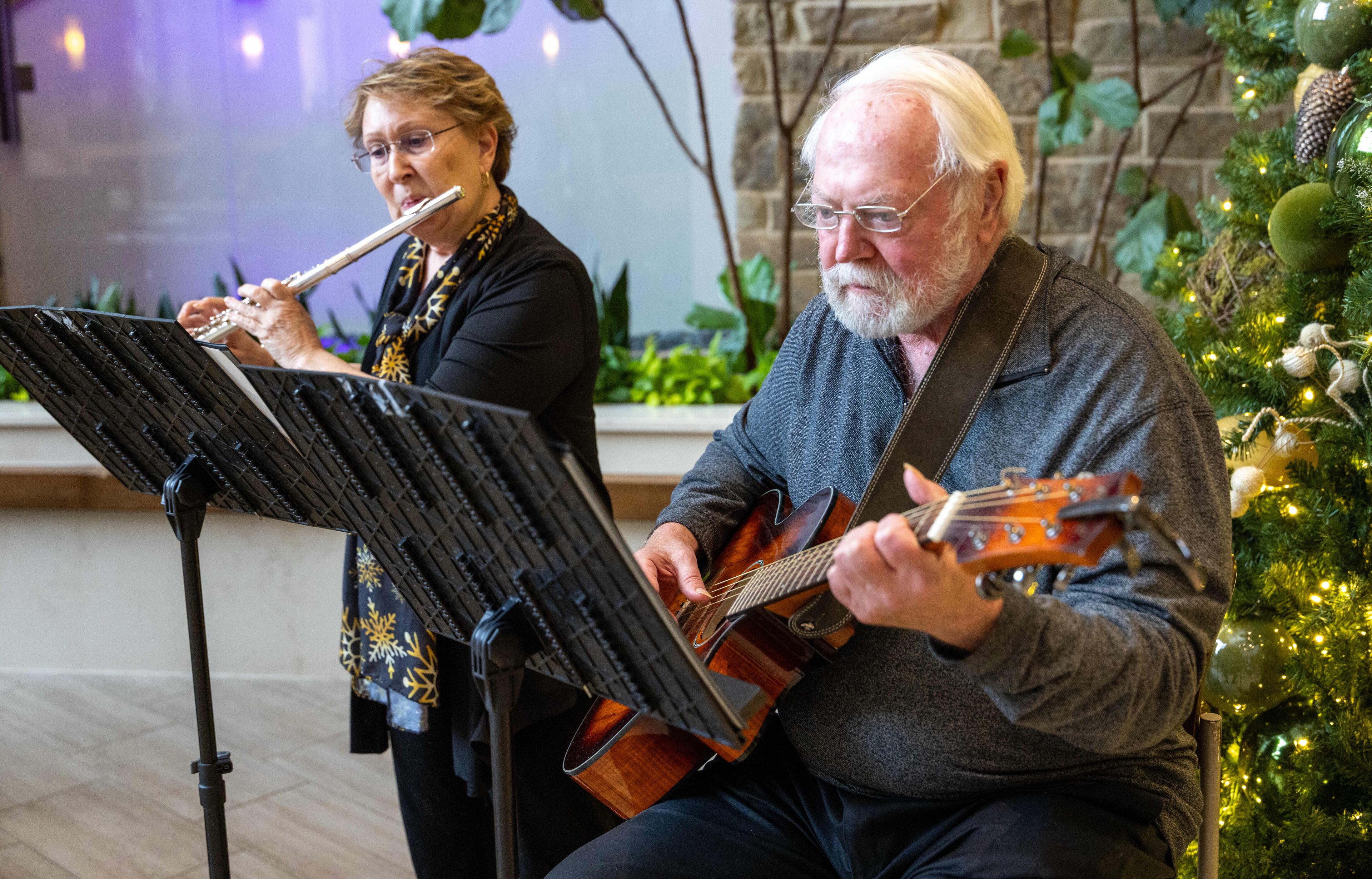 Barb Russell and Dave Walter typically perform three days a week — sometimes five at Christmas. They have no plans to stop anytime soon, Russell said. (Phil Skinner for the AJC)