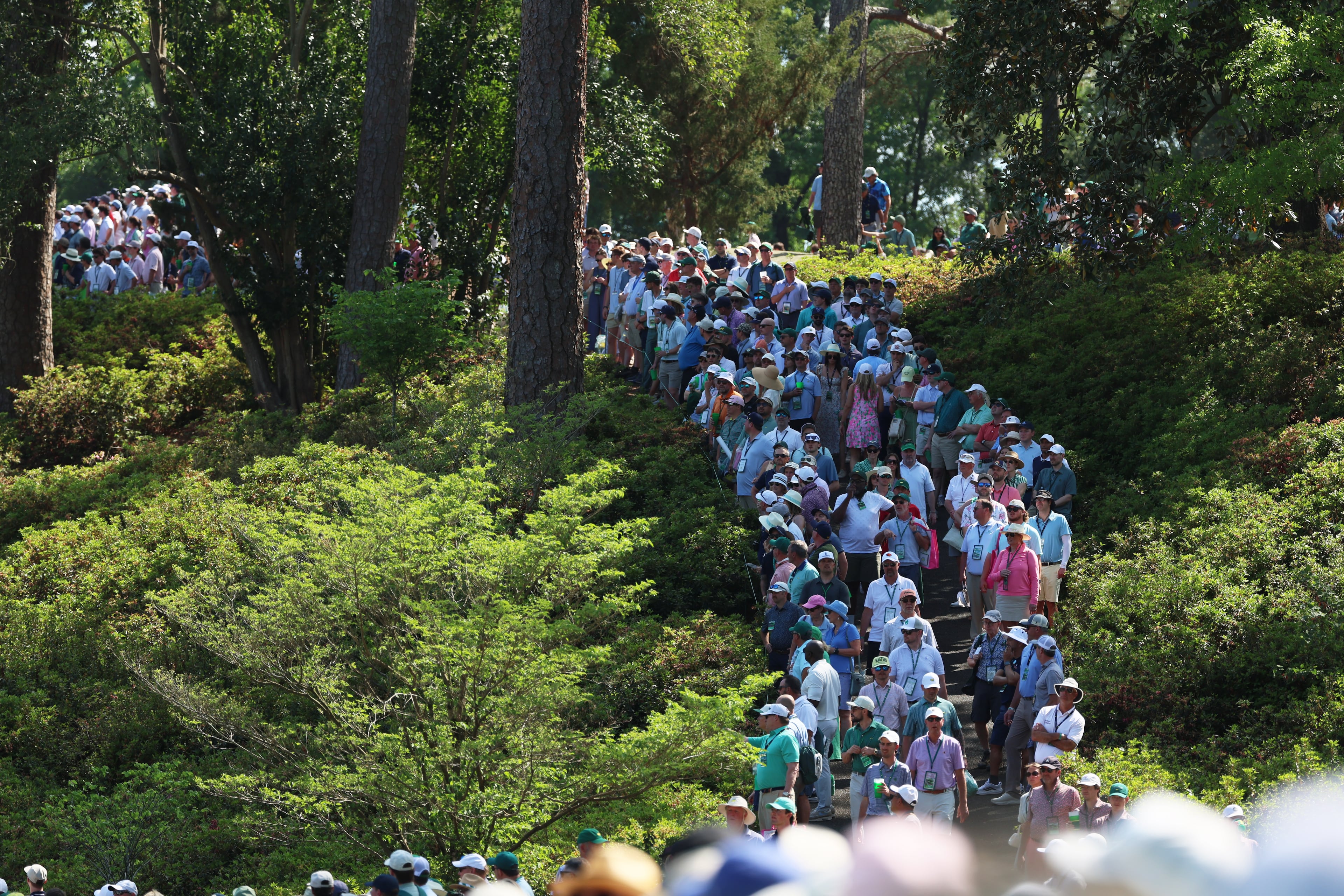 Patrons watch the leaders on sixth tee during final round of the Masters, at Augusta National Golf Club, Sunday, April 12, 2026, in Augusta, GA (Jason Getz/AJC)