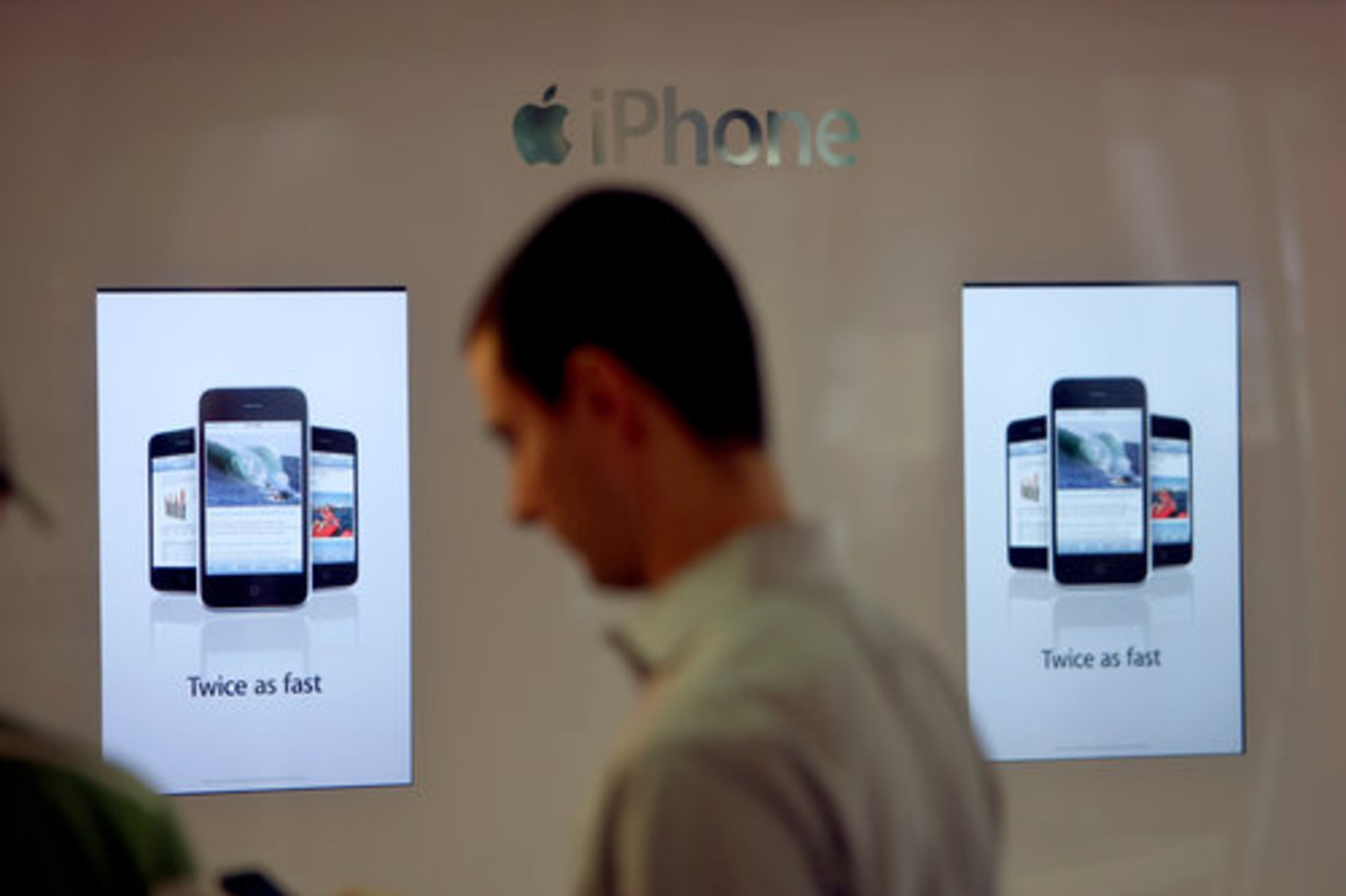 Brian Grove checks out his new phone Friday morning.