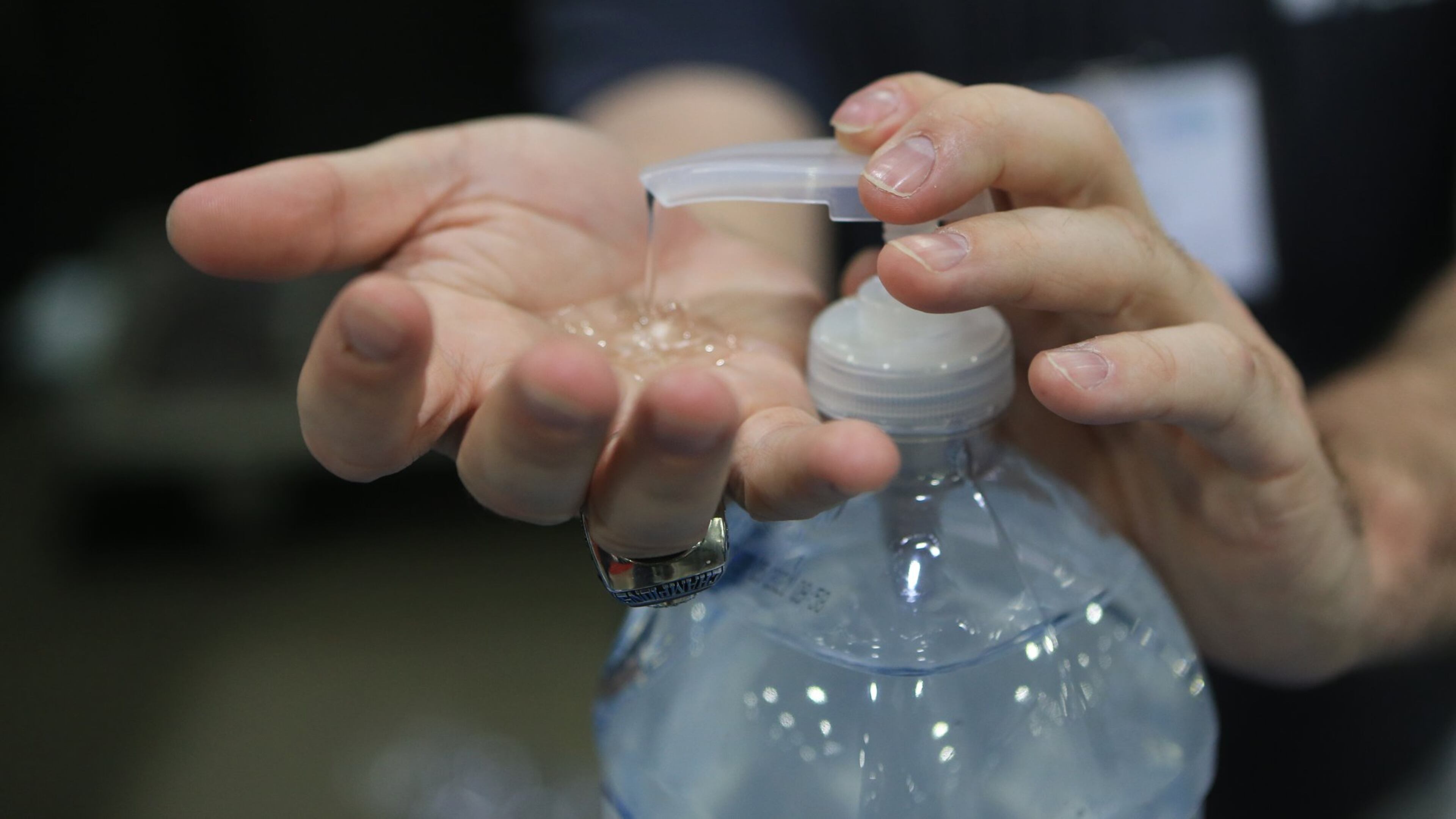 Aaron Sones uses hand sanitizer during the Construction Education Foundation of Georgia career expo on Thursday, March 12, 2020, at the Georgia World Congress Center in Atlanta. (Christina Matacotta for The Atlanta Journal-Constitution).