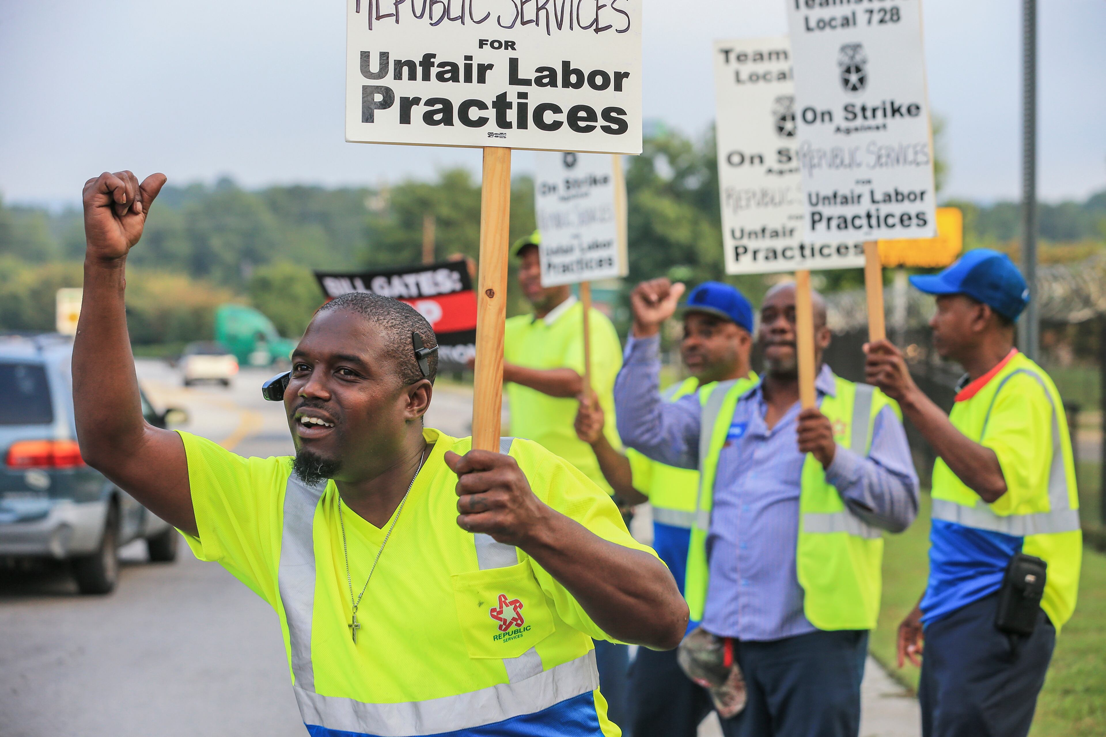 August 10, 2018 Atlanta: Jaimanuial Turner (left) and fellow workers walked a picket line Friday morning August 10, 2018 in front of Republic Services Atlanta at 3045 Donald Lee Hollowell Pkwy NW, Atlanta after more than 100 Atlanta sanitation workers walked out of their job and went on strike Thursday night. The workers wore neon yellow reflective jackets and walked in circles with signs while chanting outside of the offices of Republic Services Atlanta, their employer. Ben Speight, strike organizer, explained the workers decided to strike after Republic stopped negotiating contracts. ìThe company has halted bargaining and negotiating with these workers,î said Speight. ìThey refuse to reduce employees cost of health insurance. Workers donÃt get paid for all the time they work.â This isnÃt the first time area workers have gone on strike against Republic. In 2013, workers at the McDonough site went on strike after Republic refused to pay drivers, according to Speight. The union, Local Teamsters 728, voted on Sunday to go on strike. Though they want the issues to be resolved soon, Speight explained they plan to wait things out. ìWe intend to stay out as long as it takes,î said Speight. Workers at this unit service Piedmont Hospital, Emory University, Emory Healthcare, Atlanta Public Schools, Hartsfield-Jackson Airport and some residential communities. With only one employee choosing to staying on to work, Speight believes most of scheduled services have been disrupted. The Atlanta Journal-Constitution reached out to Republic Services, but they were not immediately available for comment. JOHN SPINK/JSPINK@AJC.COM
