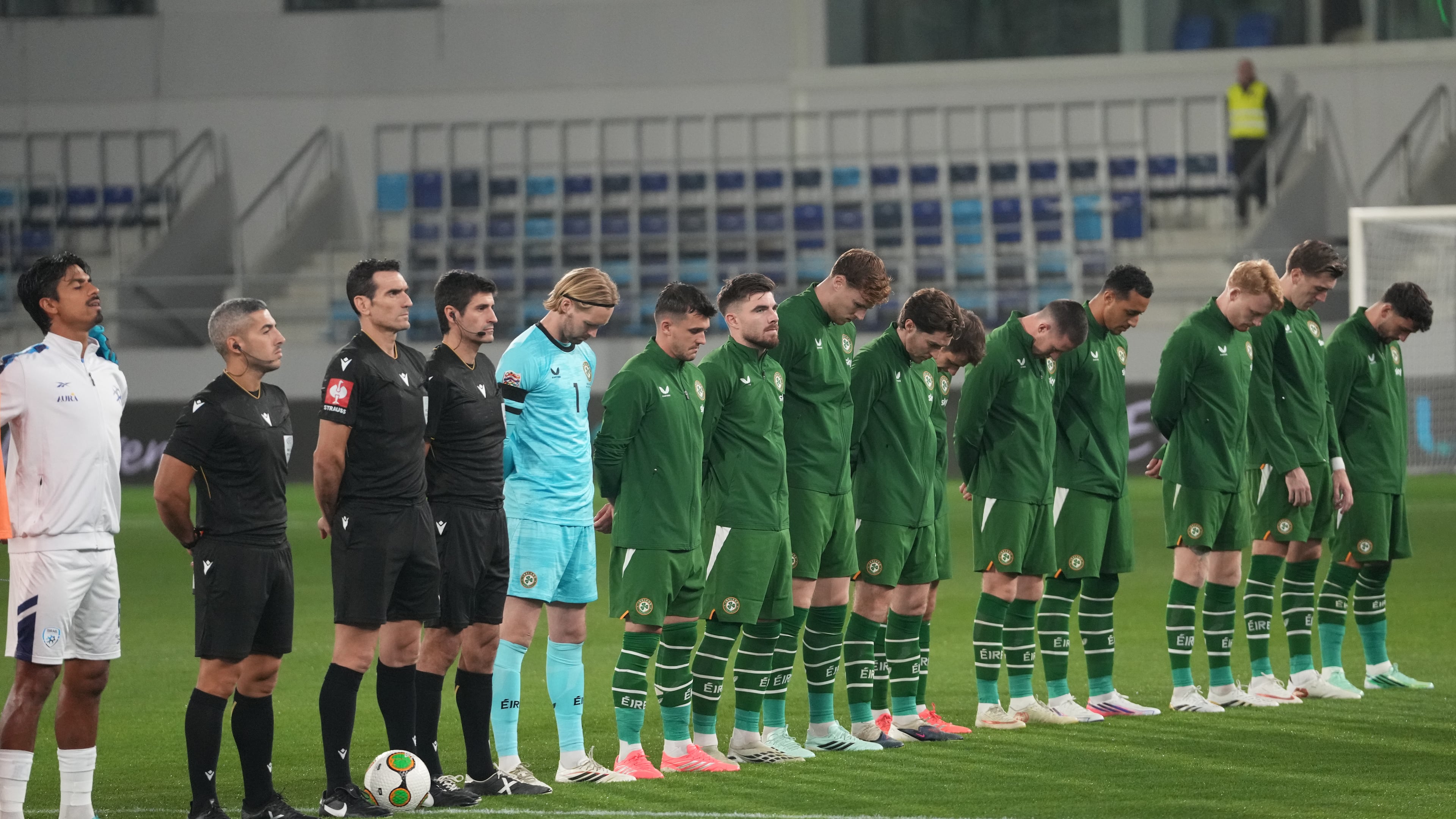 Irish players bow their heads during Israeli national anthem before the UEFA Nations League soccer match between the Republic of Ireland and Israel in Backa Topola, Serbia, Sunday, Oct. 4, 2026. (AP Photo/Darko Vojinovic)