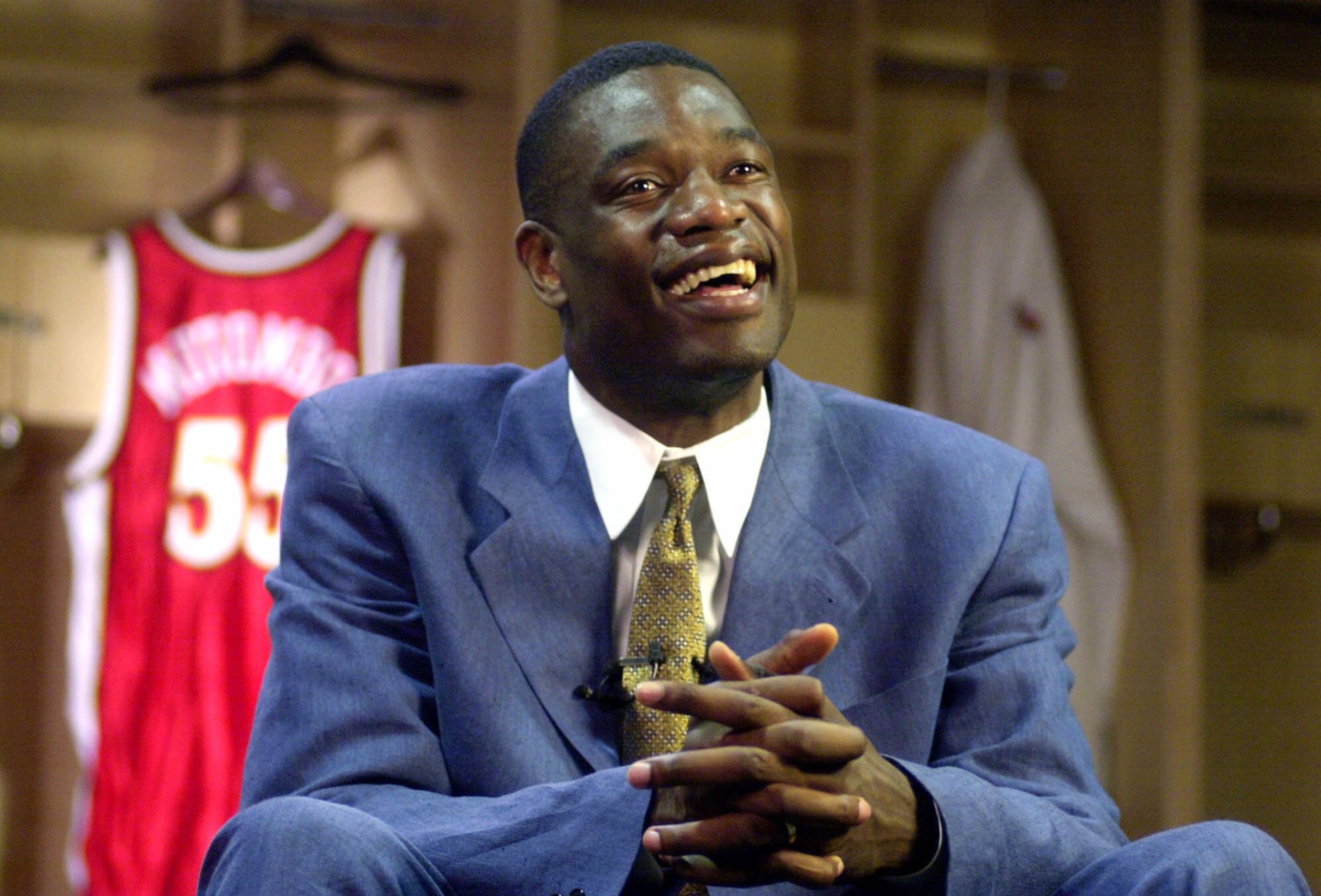 Atlanta Hawks' center Dikembe Mutombo speaks to reporters during a news conference about his selection to receive the President's Service Award, the nation's highest honor for volunteer service, Friday, June 9, 2000, in Atlanta. Mutombo established the Dikembe Mutombo Foundation to aid poor and disadvantaged people in his native country, the Democratic Republic of the Congo. (AP Photo/John Bazemore)