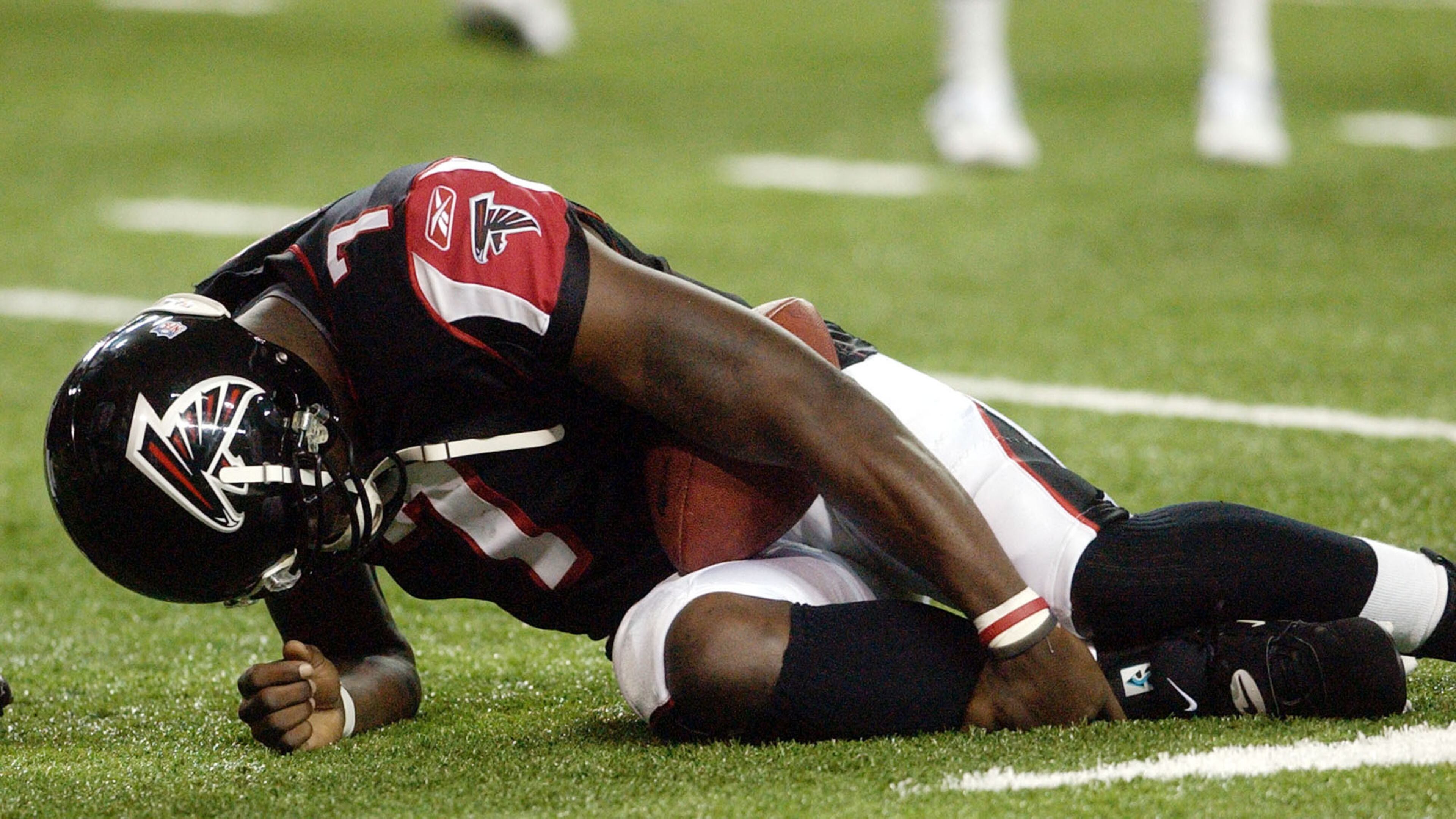 Falcons quarterback Michael Vick broke his leg in a 2003 preseason game. (John Amis/AP 2003)