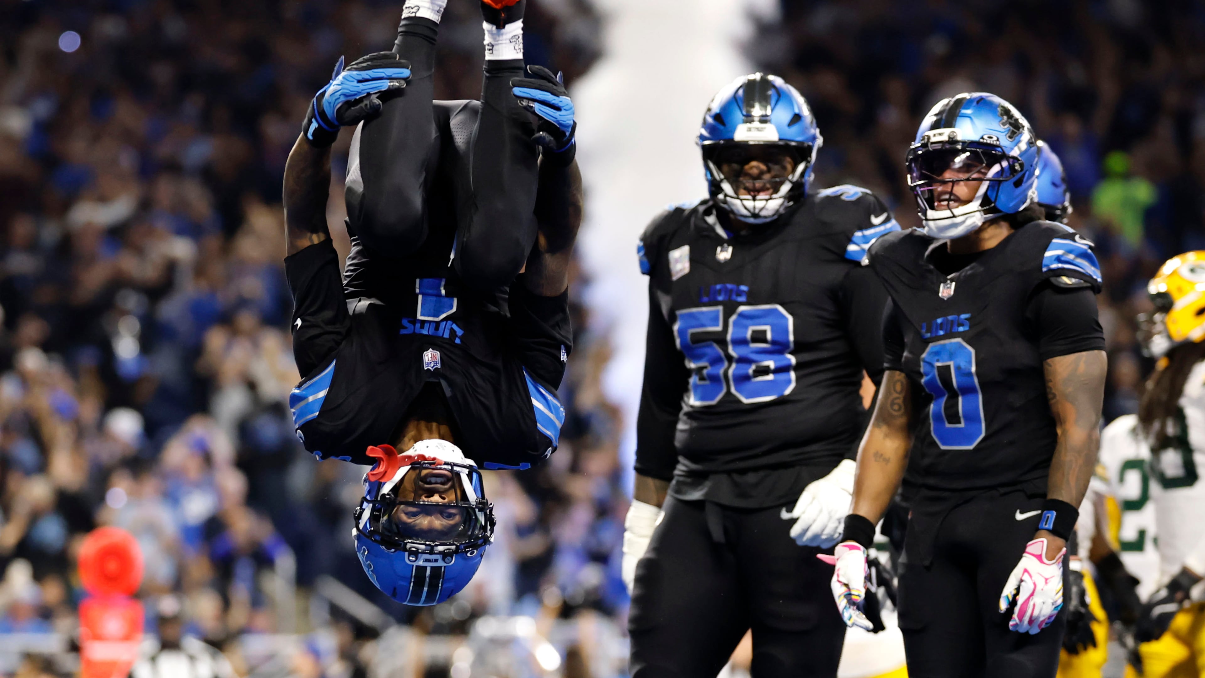 Detroit Lions wide receiver Jameson Williams (1) does a flip after catching a touchdown pass during the second half of an NFL football game against the Green Bay Packers, Sunday, Oct. 25, 2026, in Detroit. (AP Photo/Rey Del Rio)