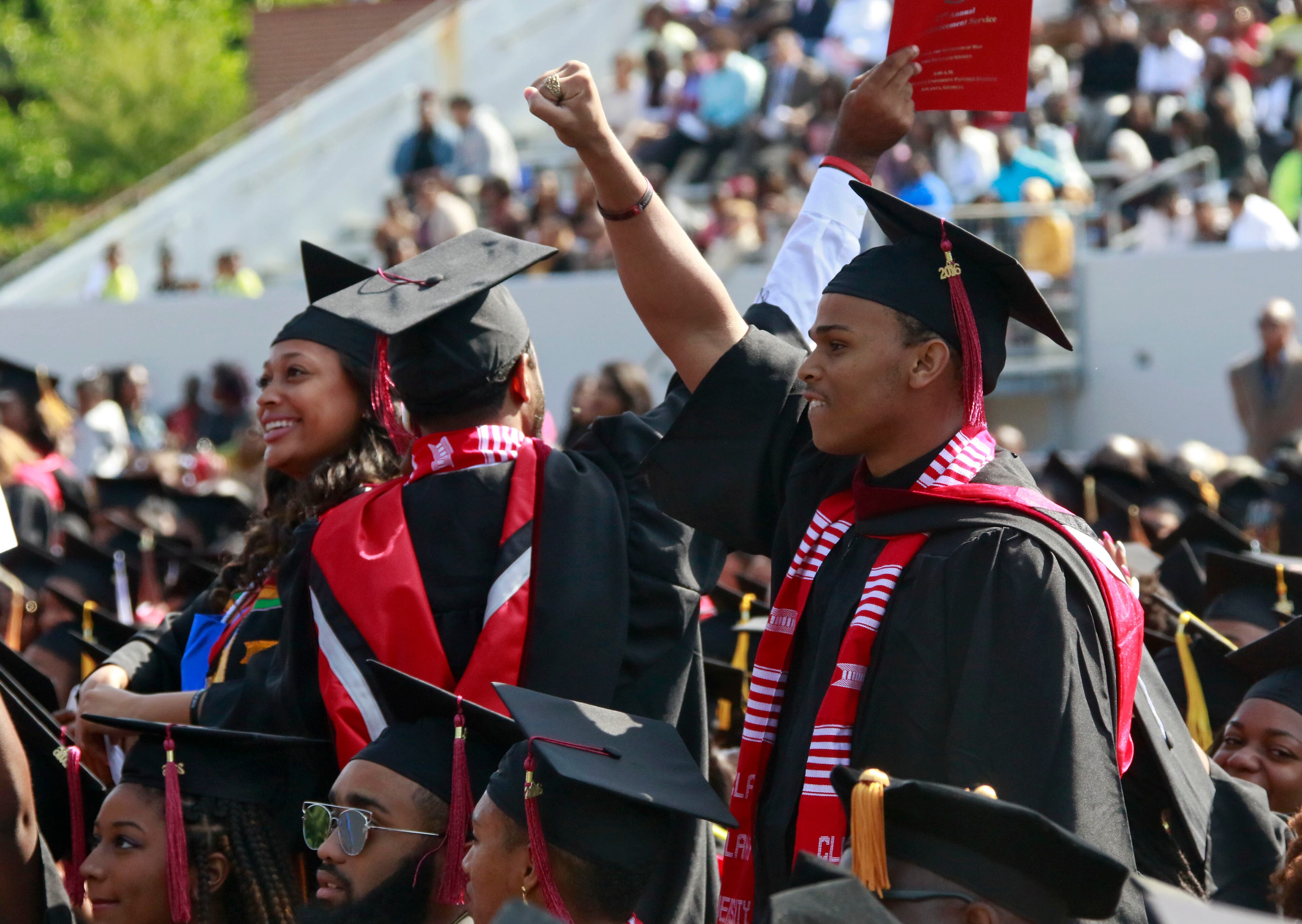 May 16, 2016 - Atlanta - Graduates react as the Clark Atlanta University Concert Choir performs "Precious Lord, Take My Hand." Clark Atlanta University class of 2016 filled Panther Stadium Monday morning for it's 27th annual Commencement Service. The keynote speaker was retired astronaut Mae Jemison, the first woman of color in Space. Honorary degrees were awarded to Hamilton Bohannon, a 1964 graduate of Clark College; Roland Carter; Congressman John Conyers, and Congressman Hank Johnson, a 1976 Clark College graduate. BOB ANDRES / BANDRES@AJC.COM