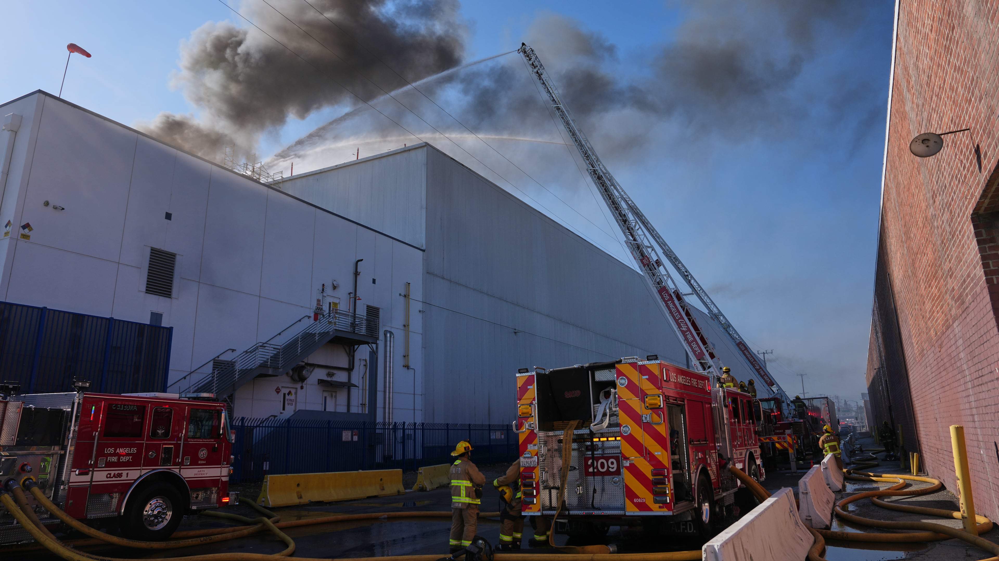 Crews work a warehouse fire in the Boyle Heights section of Los Angeles on Wednesday, June 17, 2026. (AP Photo/Jae C. Hong)