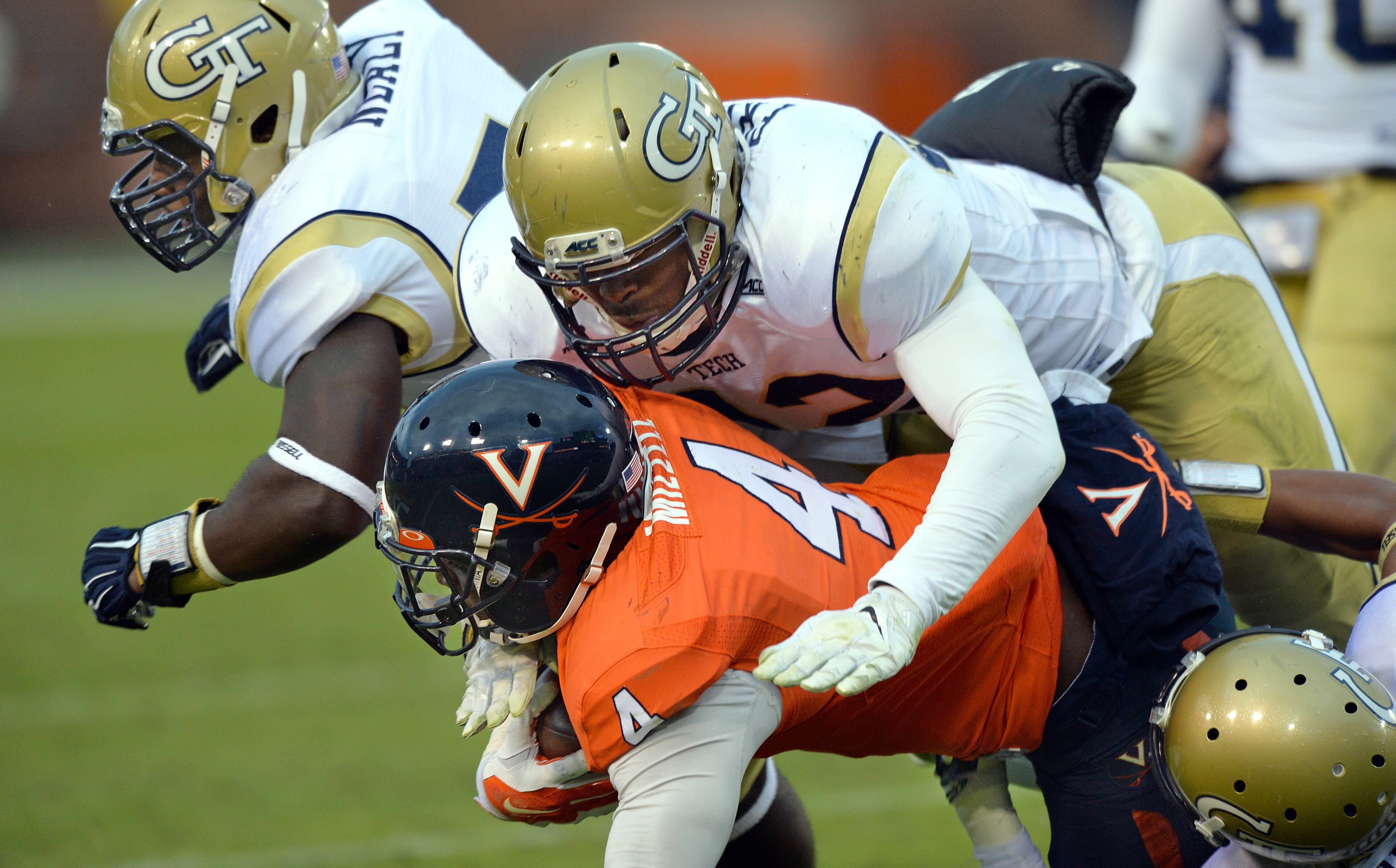Defensive end KeShun Freeman: In his stellar freshman season, Freeman (42) brings down Virginia running back Taquan Mizzell on Nov. 1, 2014 at Bobby Dodd Stadium. HYOSUB SHIN / HSHIN@AJC.COM