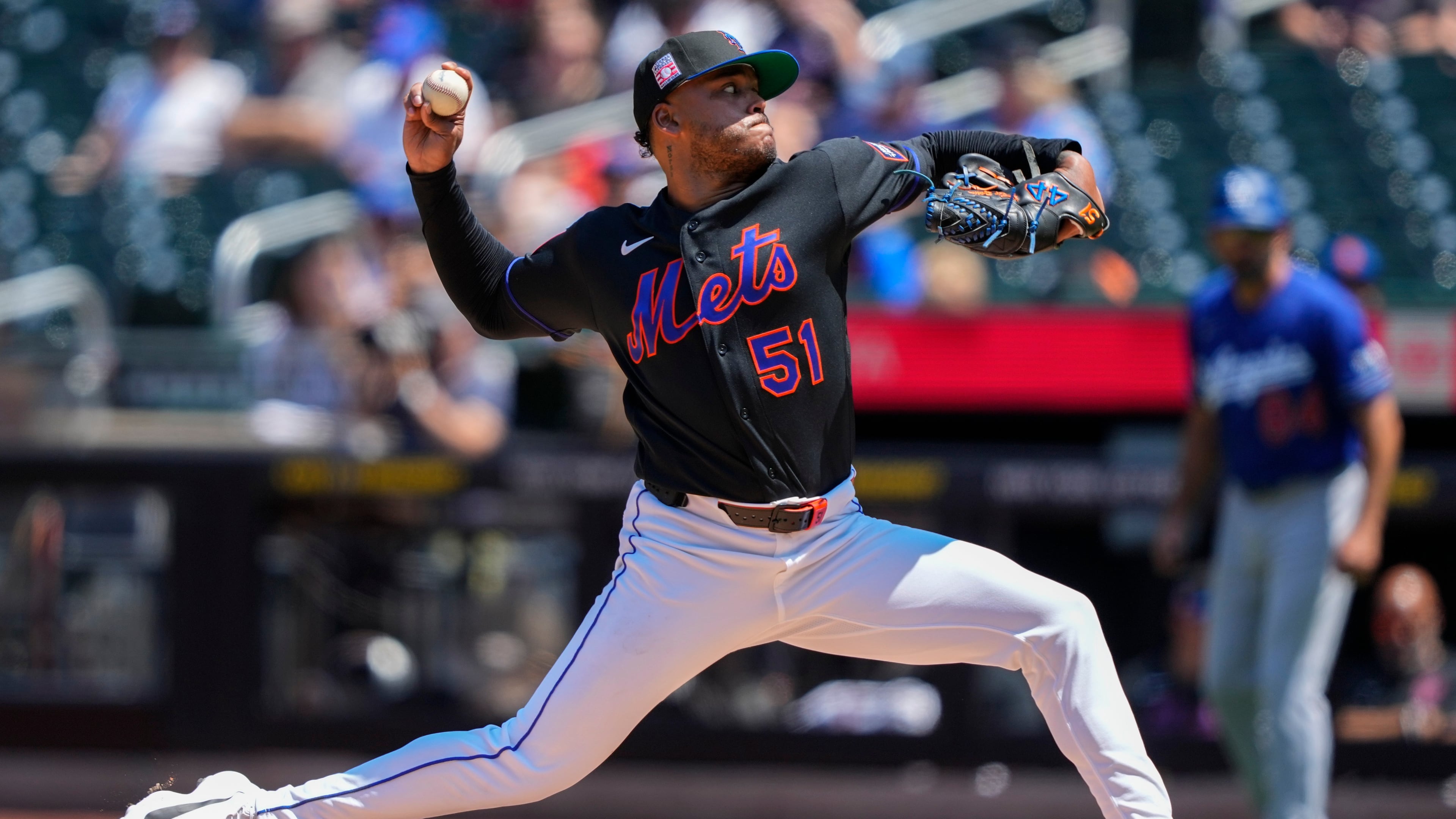 New York Mets pitcher Freddy Peralta (51) throws during the first inning of a baseball game against the Los Angeles Dodgers, Sunday, July 26, 2026, in New York. (AP Photo/Yuki Iwamura)