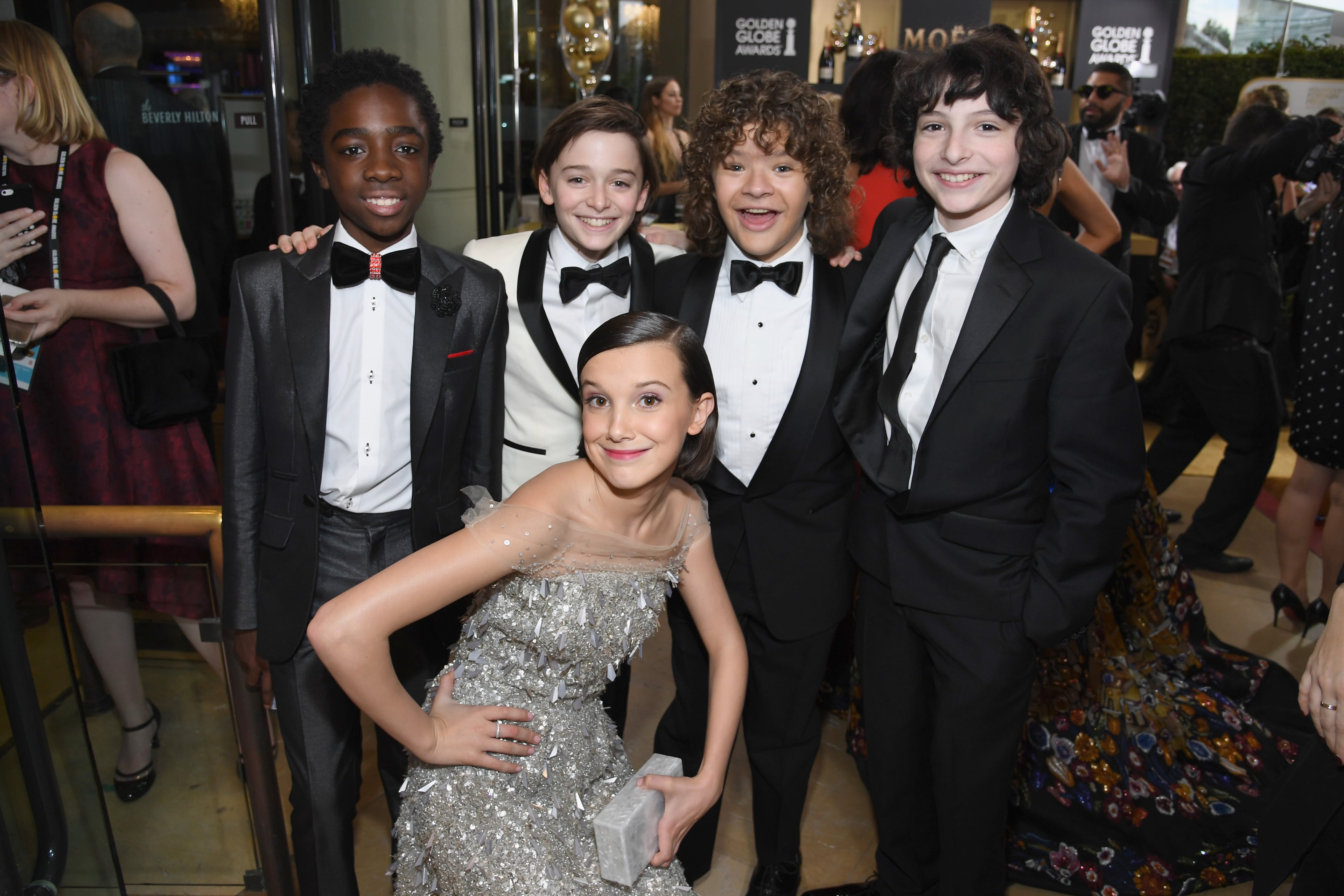 BEVERLY HILLS, CA - JANUARY 08: (L-R) Actors Caleb McLaughlin, Noah Schnapp, Gaten Matarazzo, Finn Wolfhard, and (bottom) Millie Bobby Brown at the 74th annual Golden Globe Awards sponsored by FIJI Water at The Beverly Hilton Hotel on January 8, 2017 in Beverly Hills, California. (Photo by Charley Gallay/Getty Images for FIJI Water)