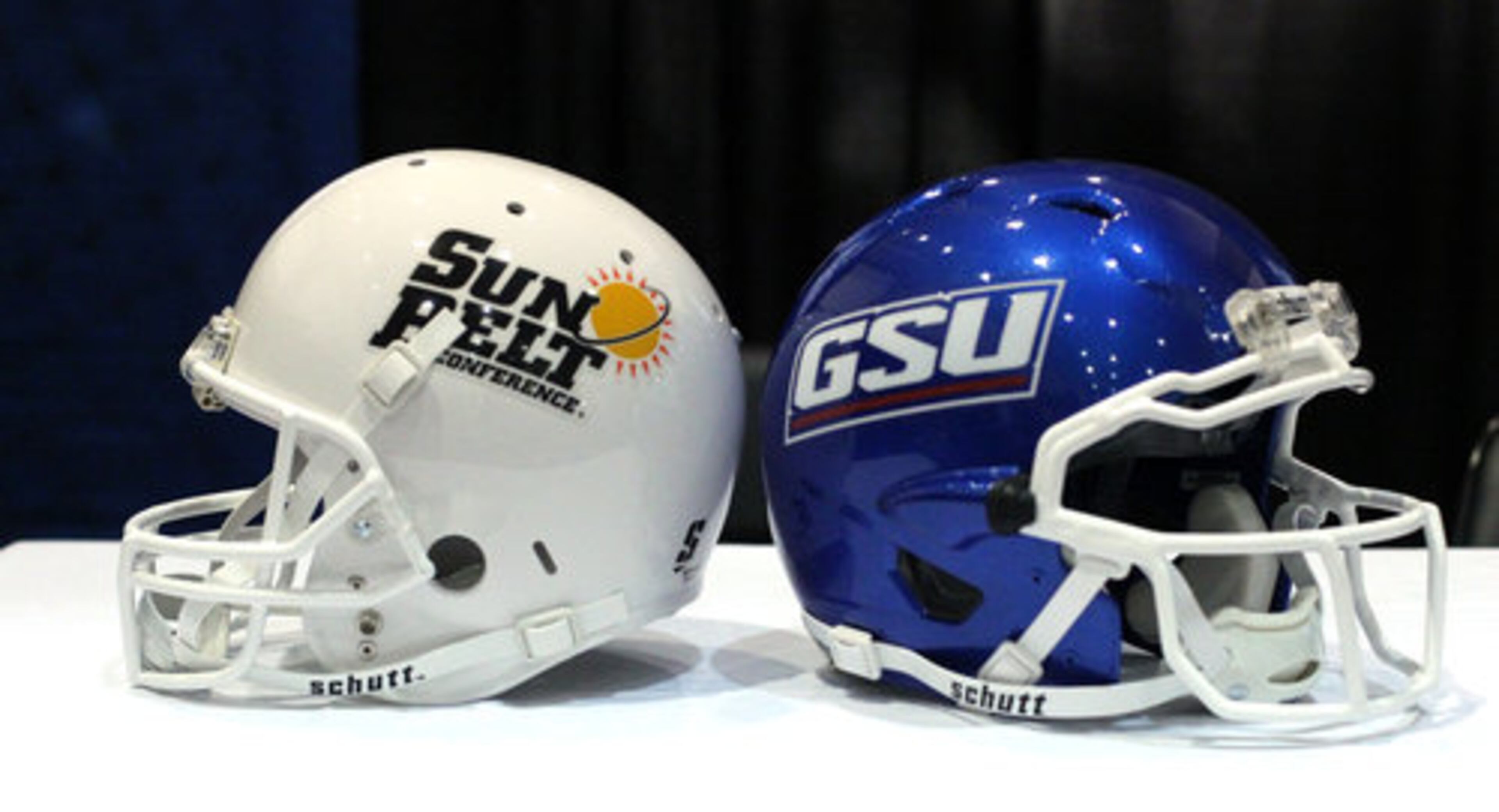 The Sun Belt Conference football helmet is shown next to the Georgia State University football helmet after GSU announced it's plans to join the Sun Belt Conference in July 2013 at the Georgia Dome Monday afternoon in Atlanta, Ga., April 9, 2012.