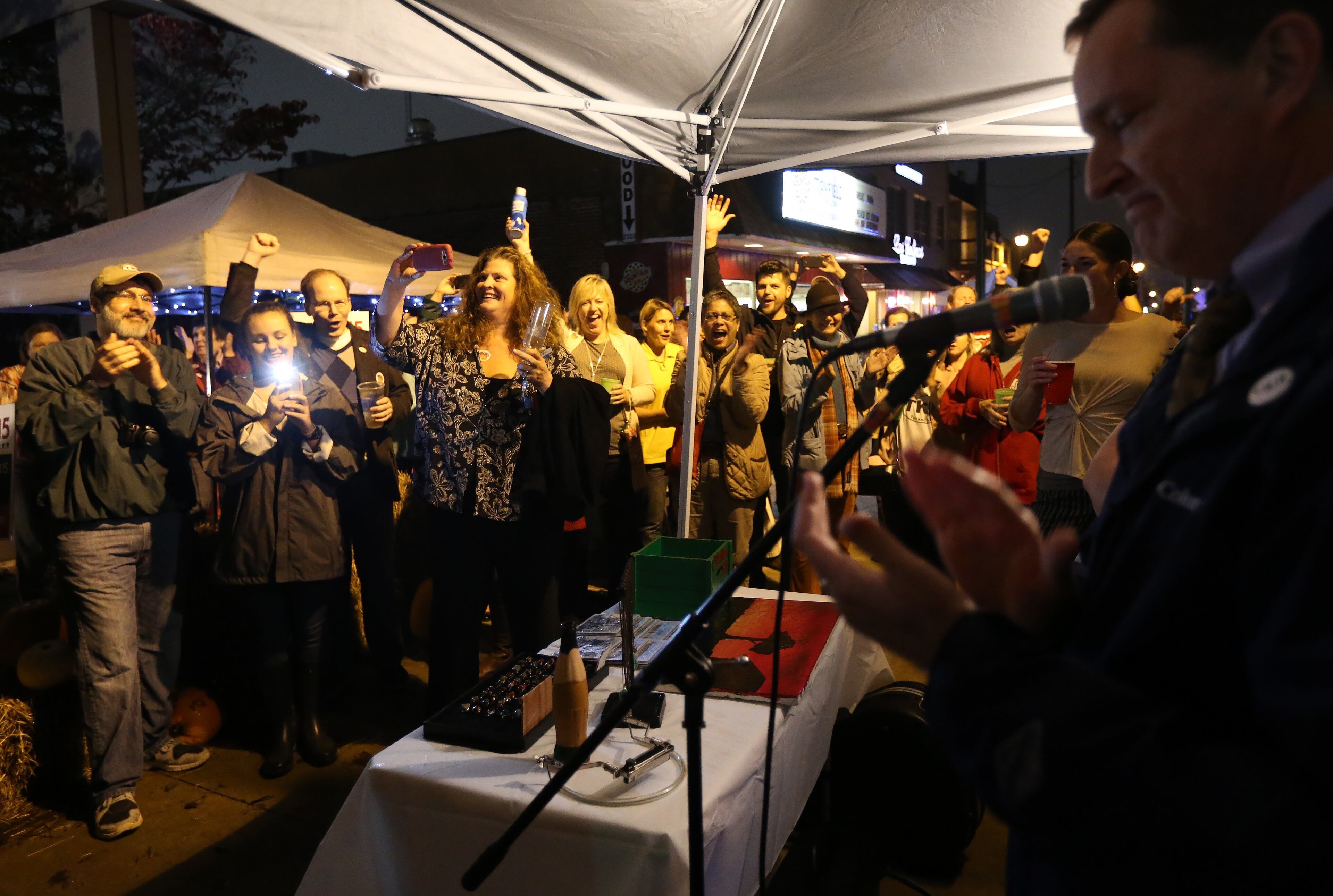 No Supporters of Tucker cityhood cheer after Tucker 2015 trustee Frank Auman, right, announced that his calculations showed the referendum passing with more than 70 percent during an election night party on Main Street of what would become the city of Tucker. Ben Gray / bgray@ajc.com