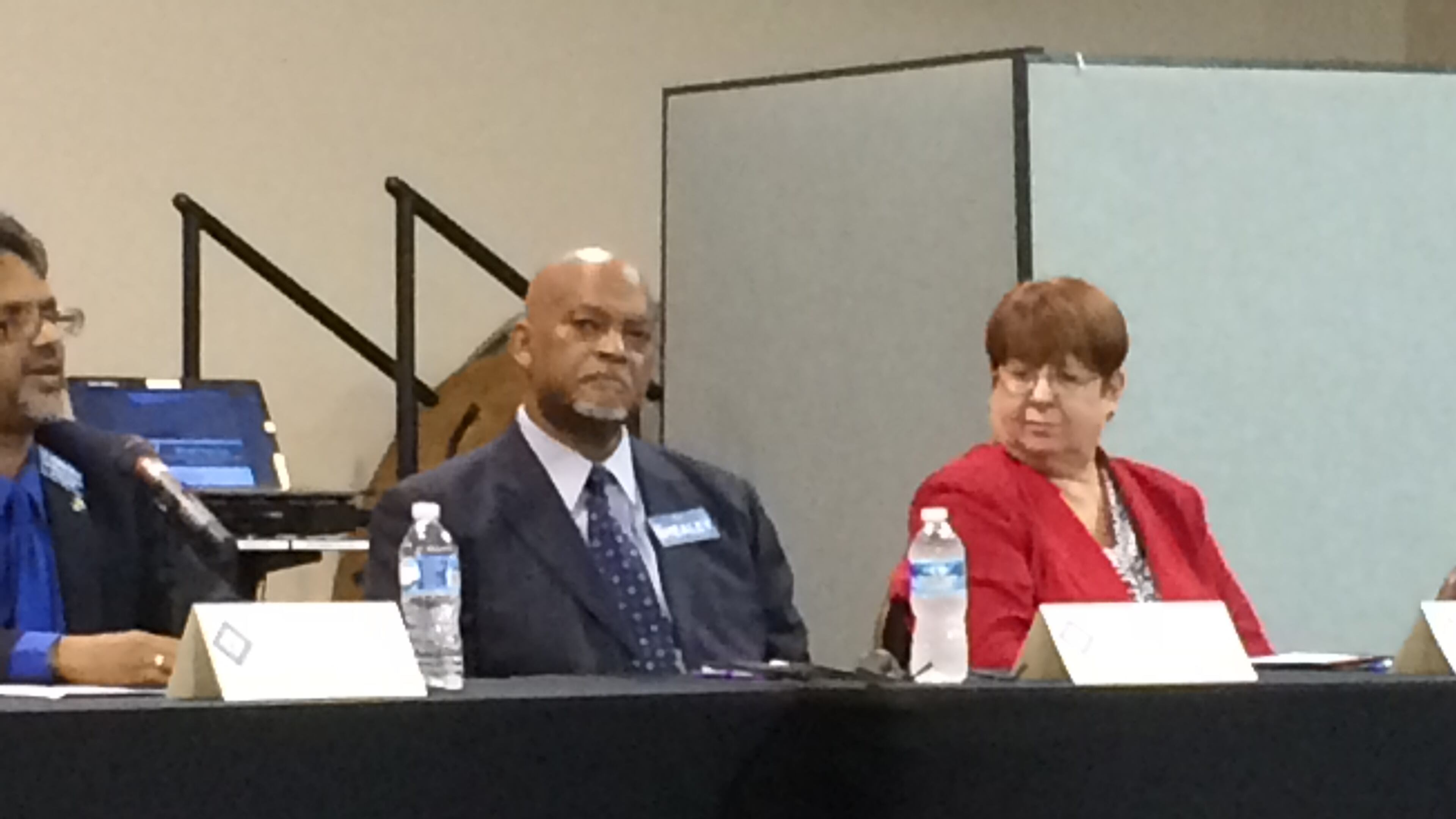 Gwinnett Democratic Party Chairman Jim Shealey (center) lost to incumbent Republican Charlotte Nash (right) in Tuesday’s election.