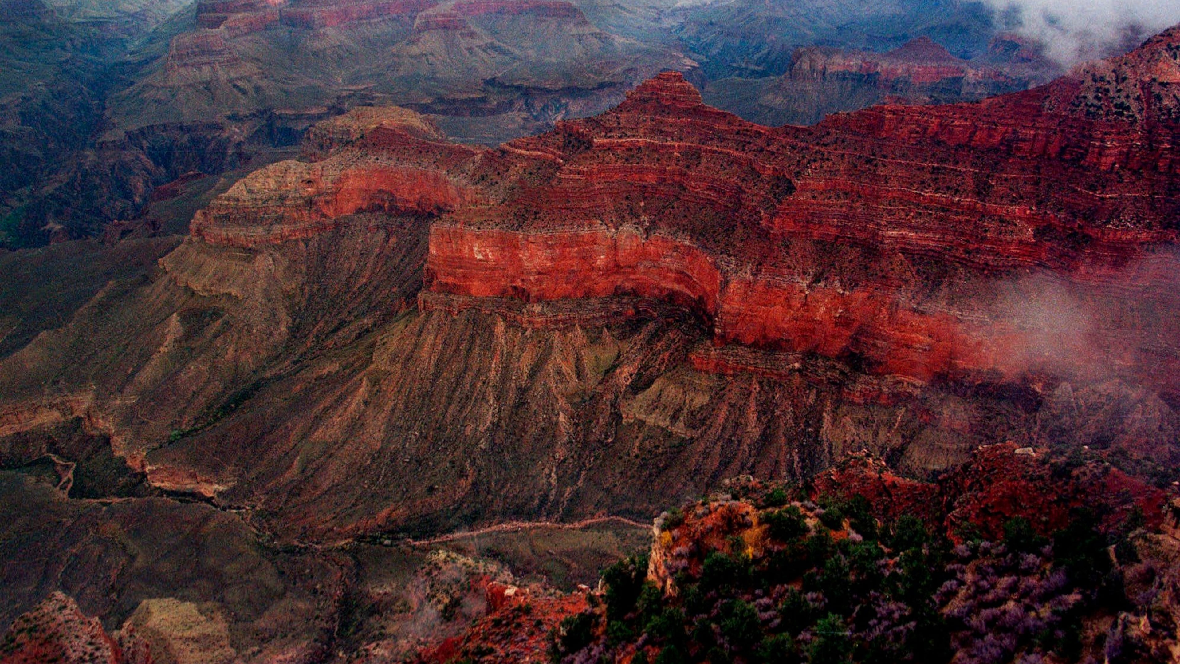 FILE - The Kaibab Trail, running right to left at center, at Grand Canyon National Park on Jan. 20, 2001. (AP Photo/Matt York, File)