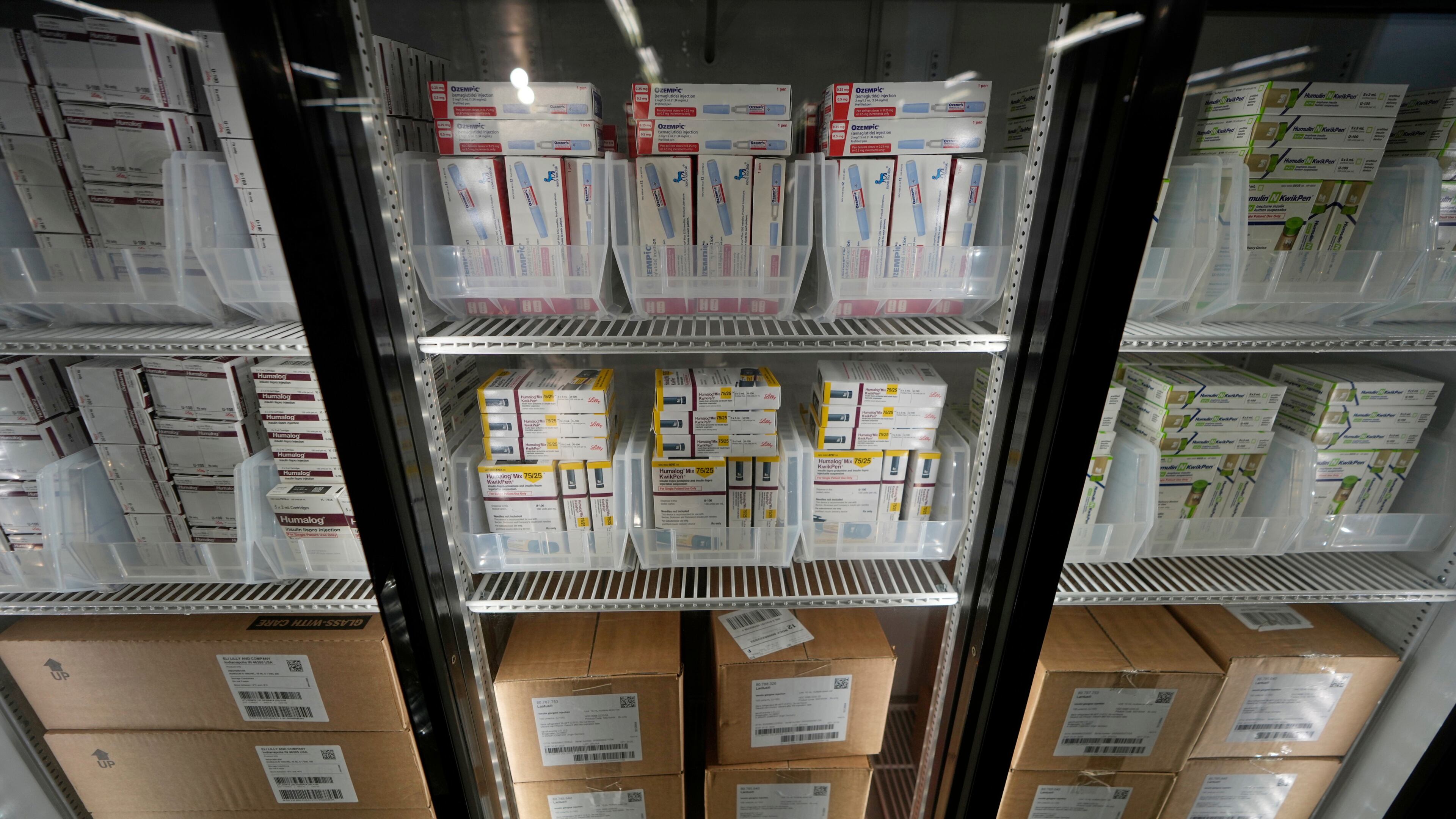 FILE - Packets of insulin vials and pens are warehoused at a Kaiser warehouse in Downey, Calif., March 18, 2023. (AP Photo/Damian Dovarganes, file)