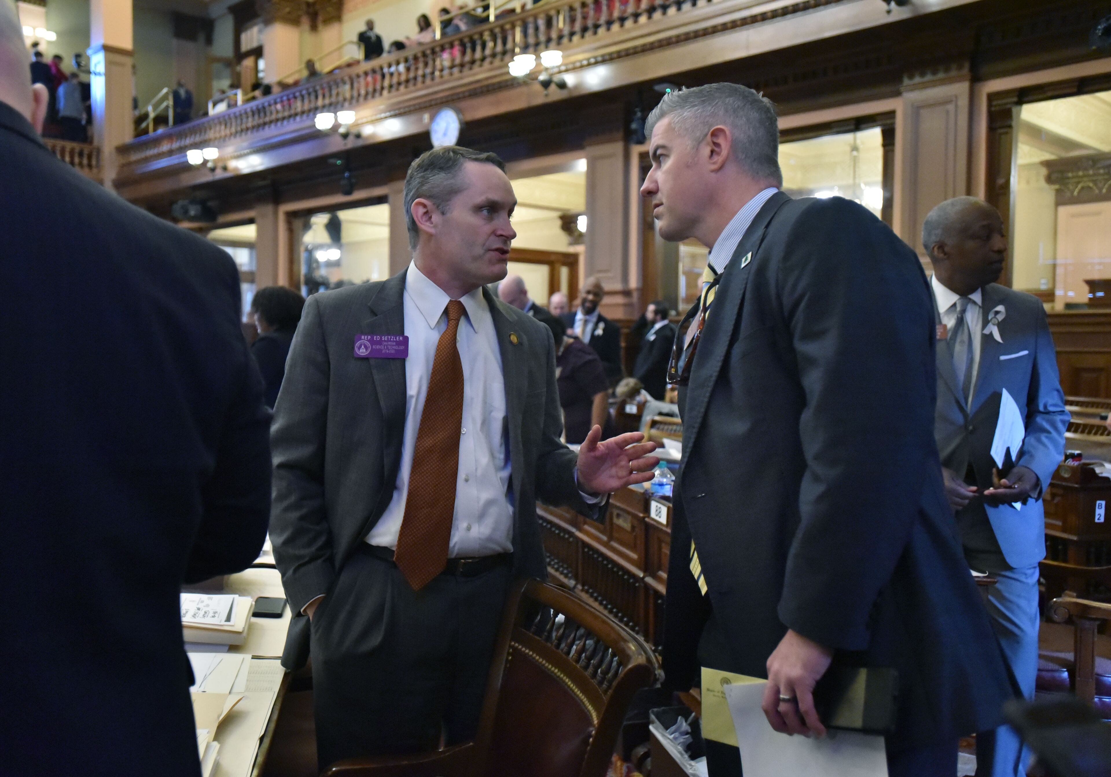 March 29, 2019 Atlanta - Rep. Ed Setzler (left) and Rep. Kevin Cooke confer during the 38th day of legislation in the House Chambers at the Georgia State Capitol on Friday, March 29, 2019. HYOSUB SHIN / HSHIN@AJC.COM