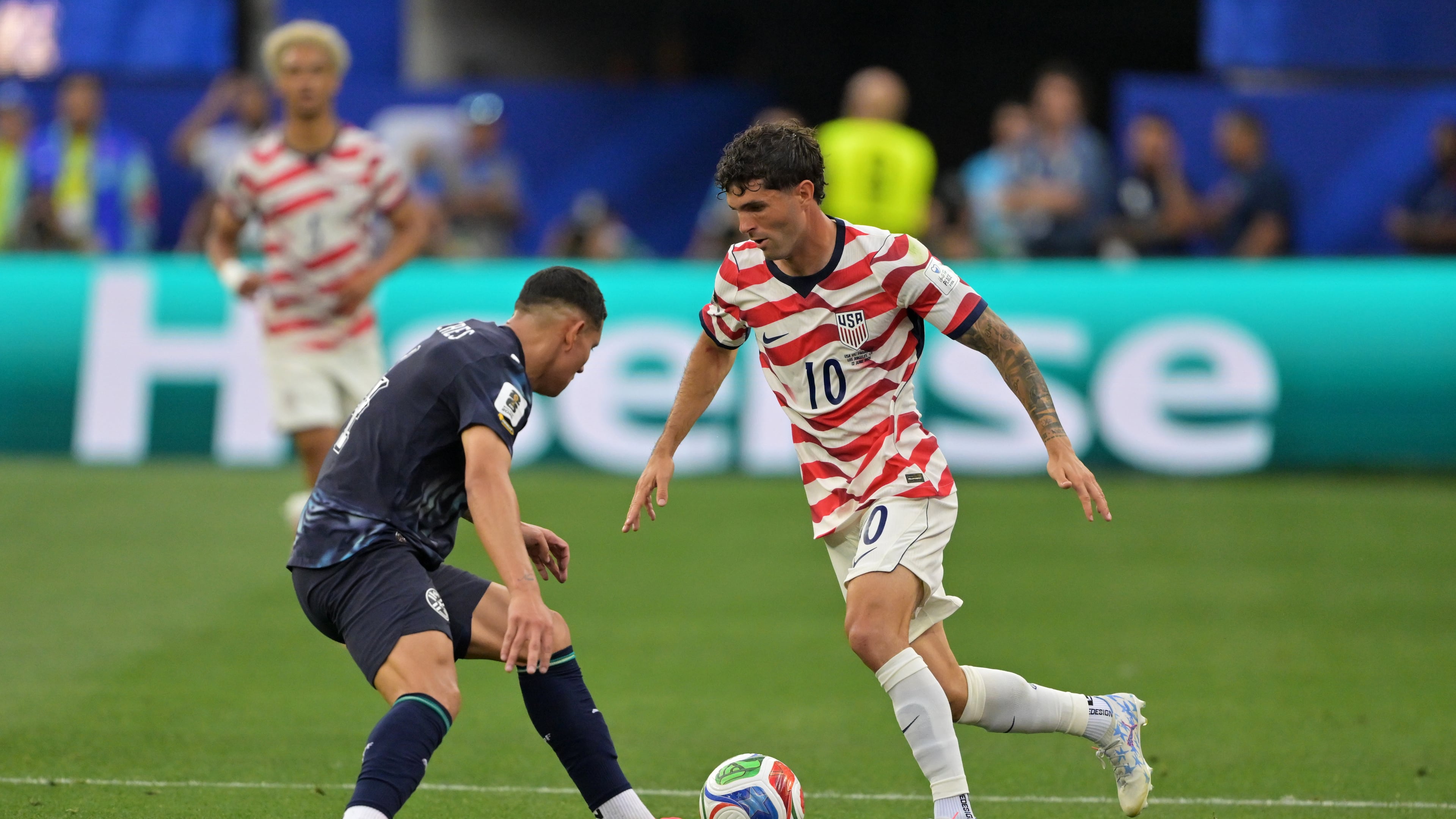 United States' Christian Pulisic (10) dribbles past Paraguay's Juan Jose Caceres during the World Cup Group D soccer match in Inglewood, Calif., near Los Angeles, Friday, June 12, 2026. (AP Photo/Jayne Kamin-Oncea)