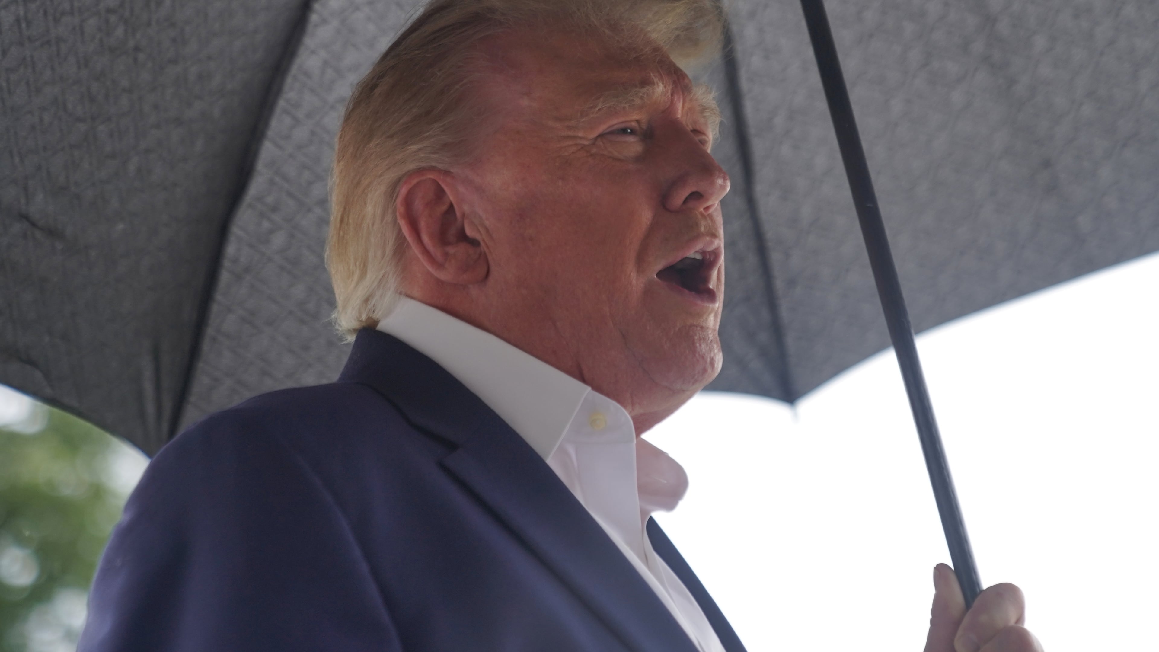 President Donald Trump talks to reporters on the South Lawn of the White House before boarding Marine One, Sunday, Sept. 27, 2026, in Washington. (AP Photo/Allison Robbert)