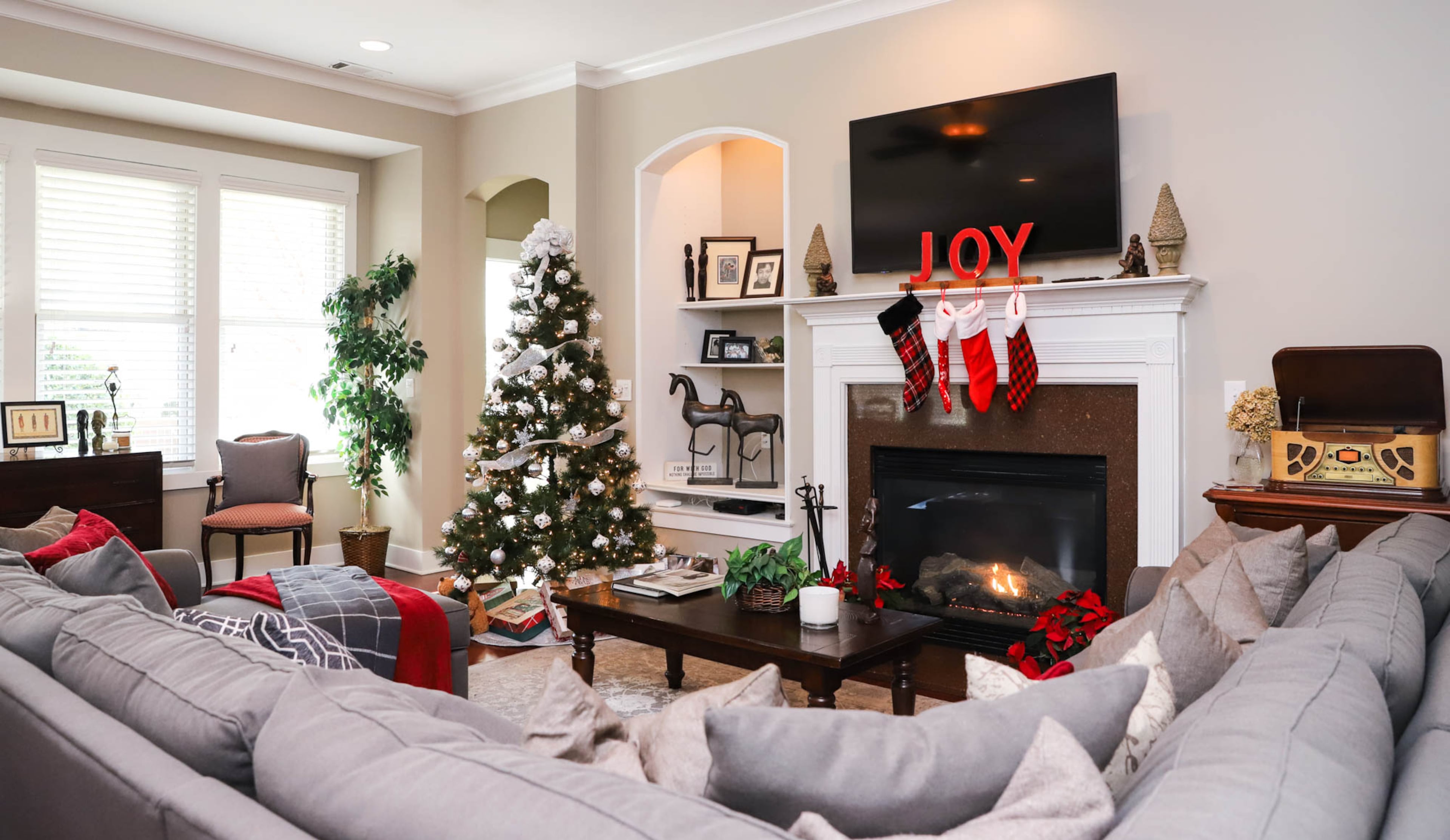 Gail Burns-Grant purchased her family room sofa, a Radley five-piece fabric chaise sectional sofa in heavenly cinder grey from Macy’s, before she found her Douglasville home. “I promised myself I was going to find a house that could accommodate a large sectional,” said Burns-Grant, who loves hosting her large family. Text by Shannon Dominy/Photo by Reynolds Rogers