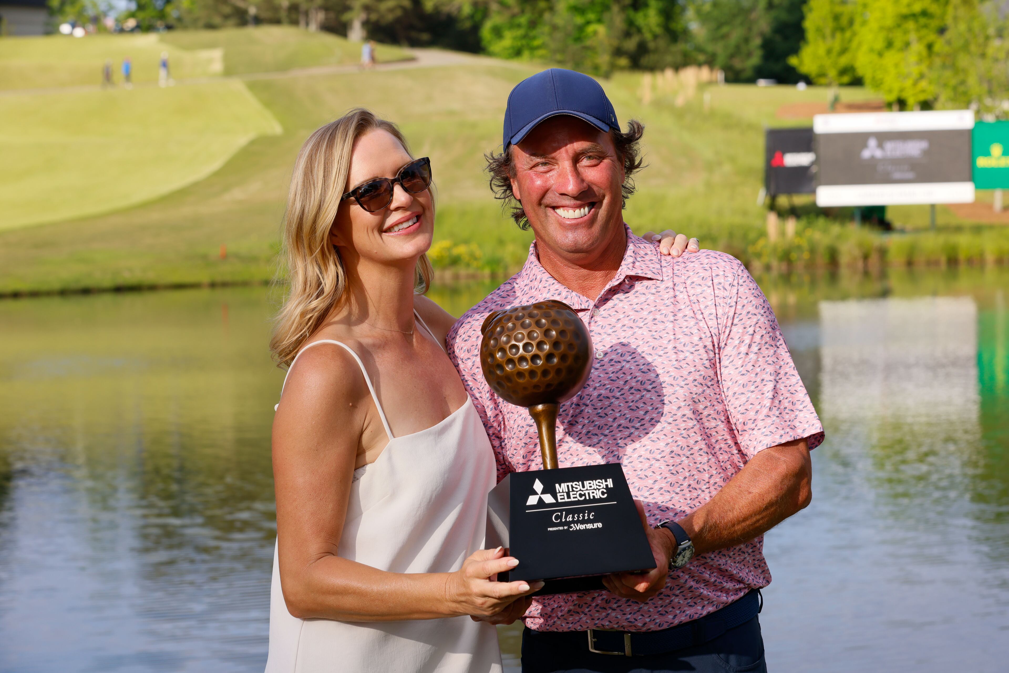 Stephen Ames poses with his wife, Kelly Norcott Ames, after winning the Mitsubishi Classic senior golf tournament at TPC Sugarloaf on Sunday, April 28, 2024, in Duluth, Ga.
(Miguel Martinez / AJC)