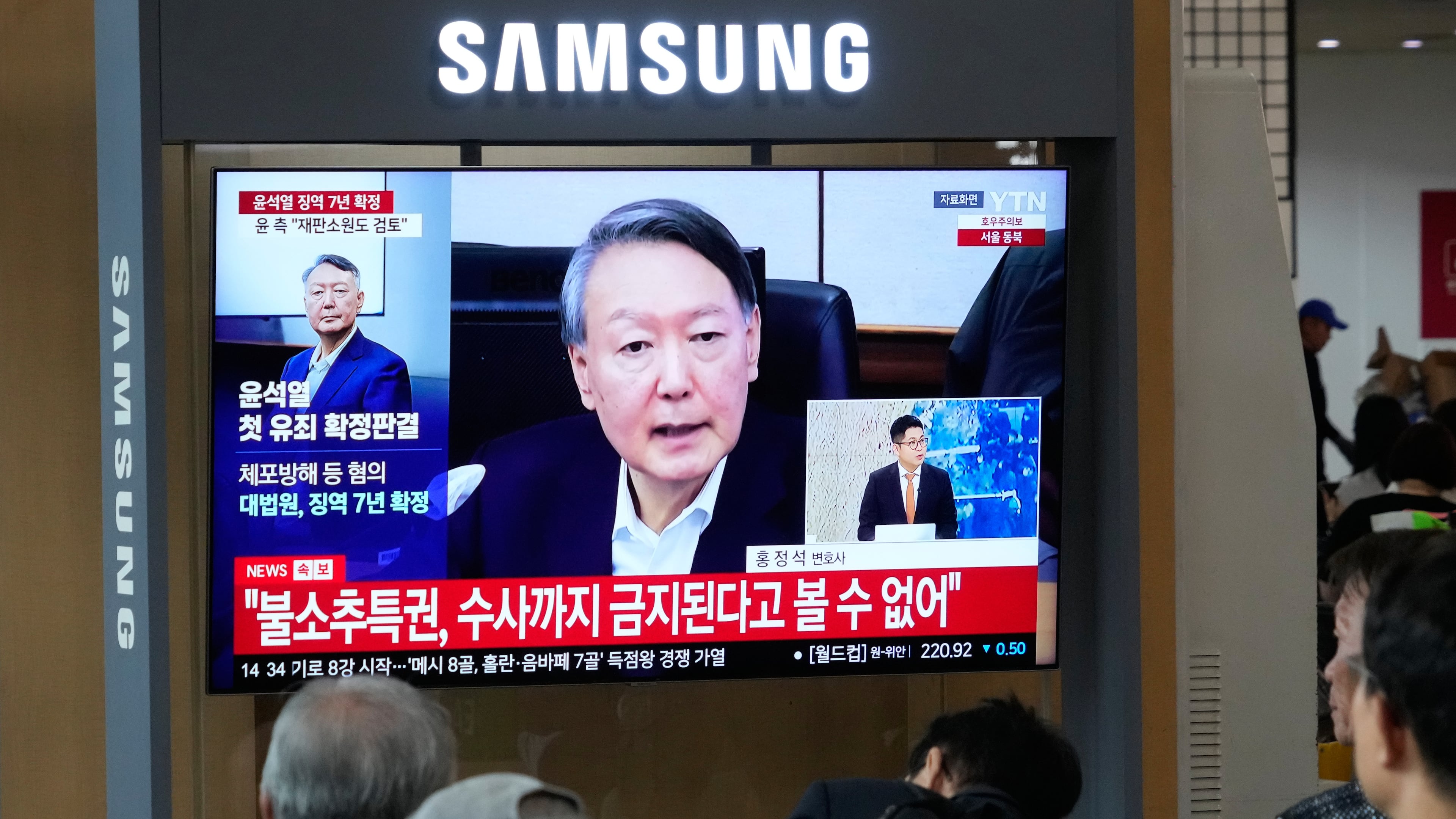A TV screen shows an image of former South Korea President Yoon Suk Yeol during a news program at the Seoul Railway Station in Seoul, South Korea, Thursday, July 9, 2026. (AP Photo/Ahn Young-joon)