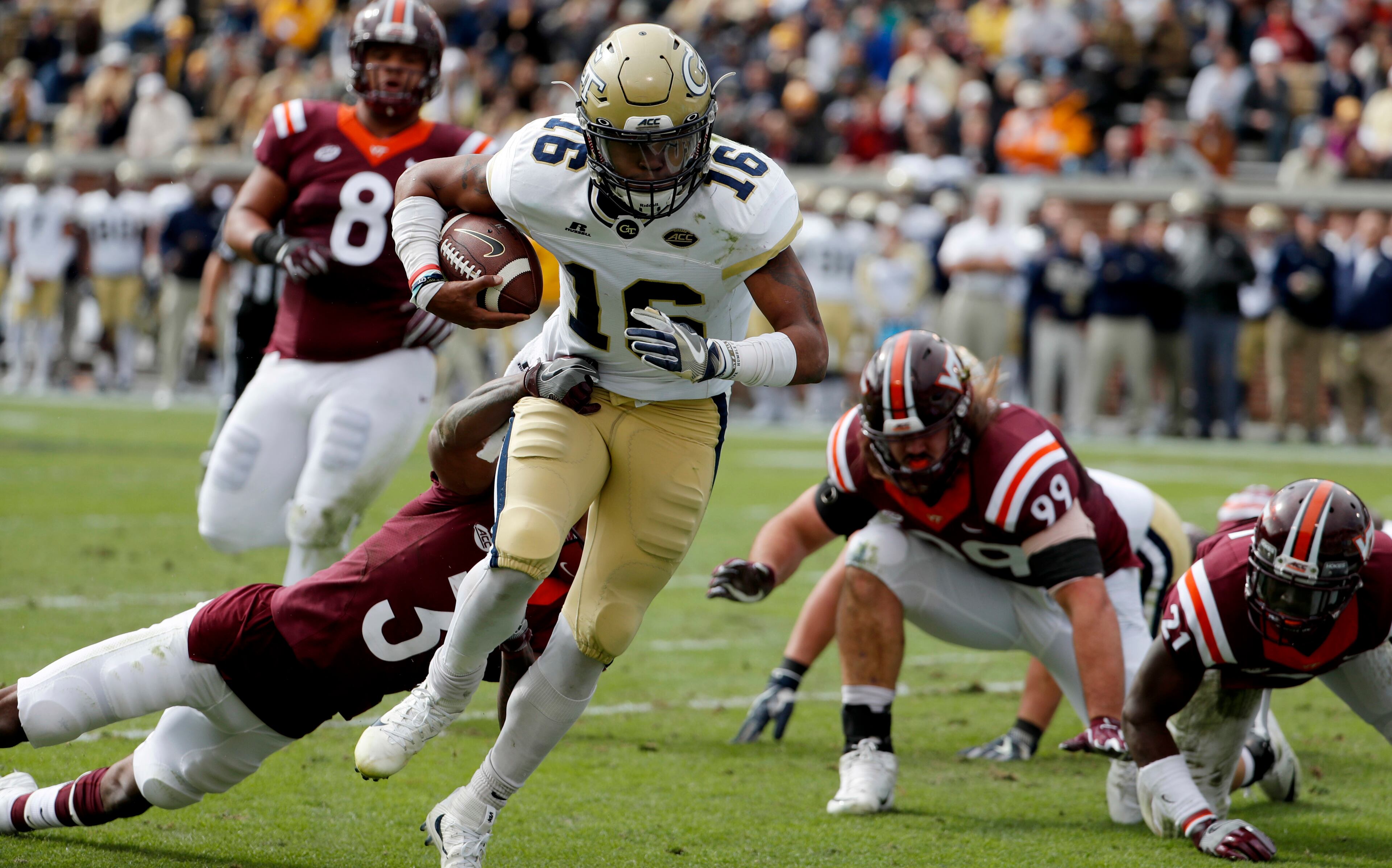 Georgia Tech quarterback TaQuon Marshall runs the ball past the reach of Virginia Tech's Greg Stroman to score a touchdown in the first quarter of an NCAA college football game in Atlanta, Saturday, Nov. 11, 2017. (AP Photo/David Goldman)