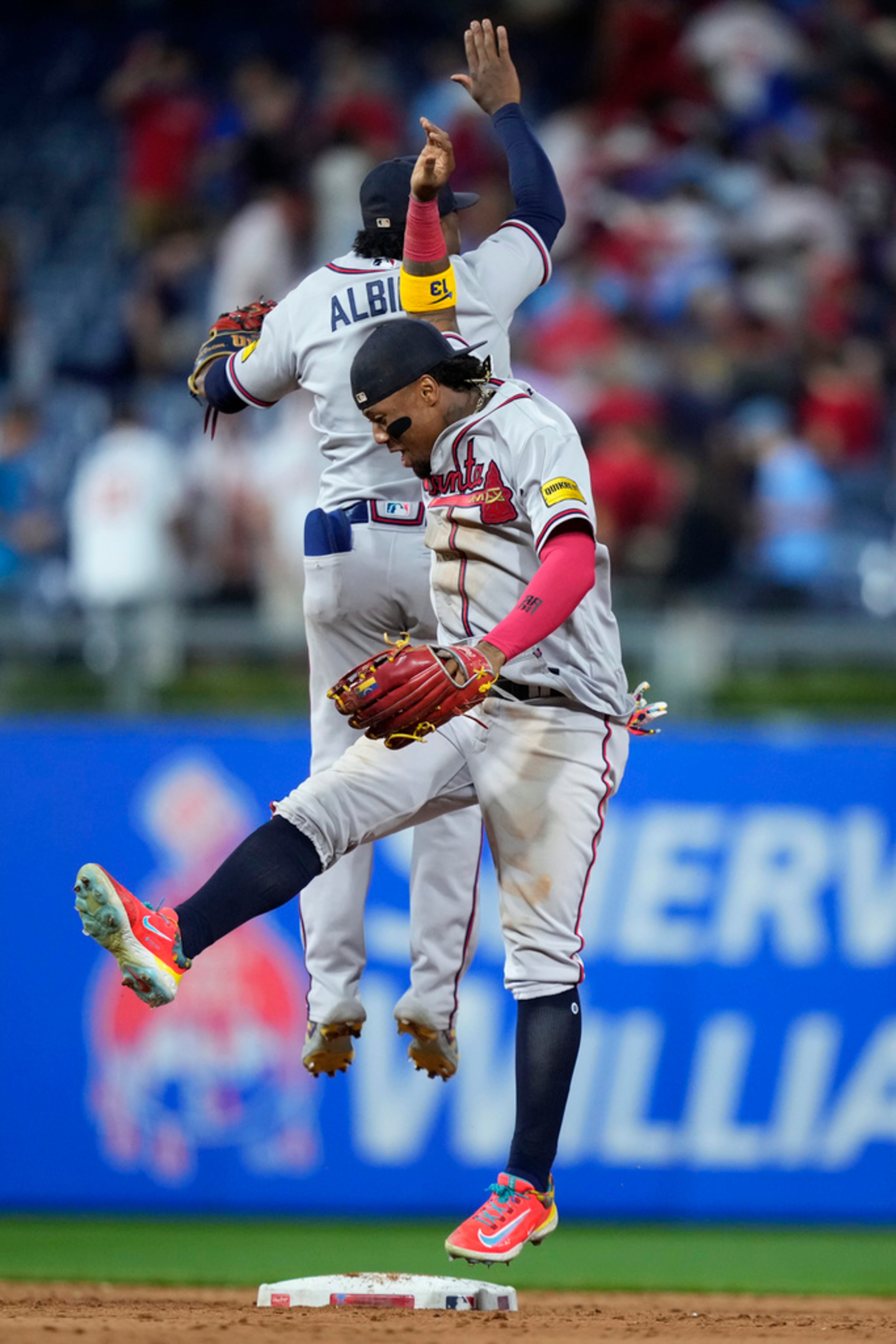 Atlanta Braves' Ronald Acuna Jr., right, and Ozzie Albies celebrate after a baseball game against the Philadelphia Phillies, Tuesday, June 20, 2023, in Philadelphia. (AP Photo/Matt Slocum)