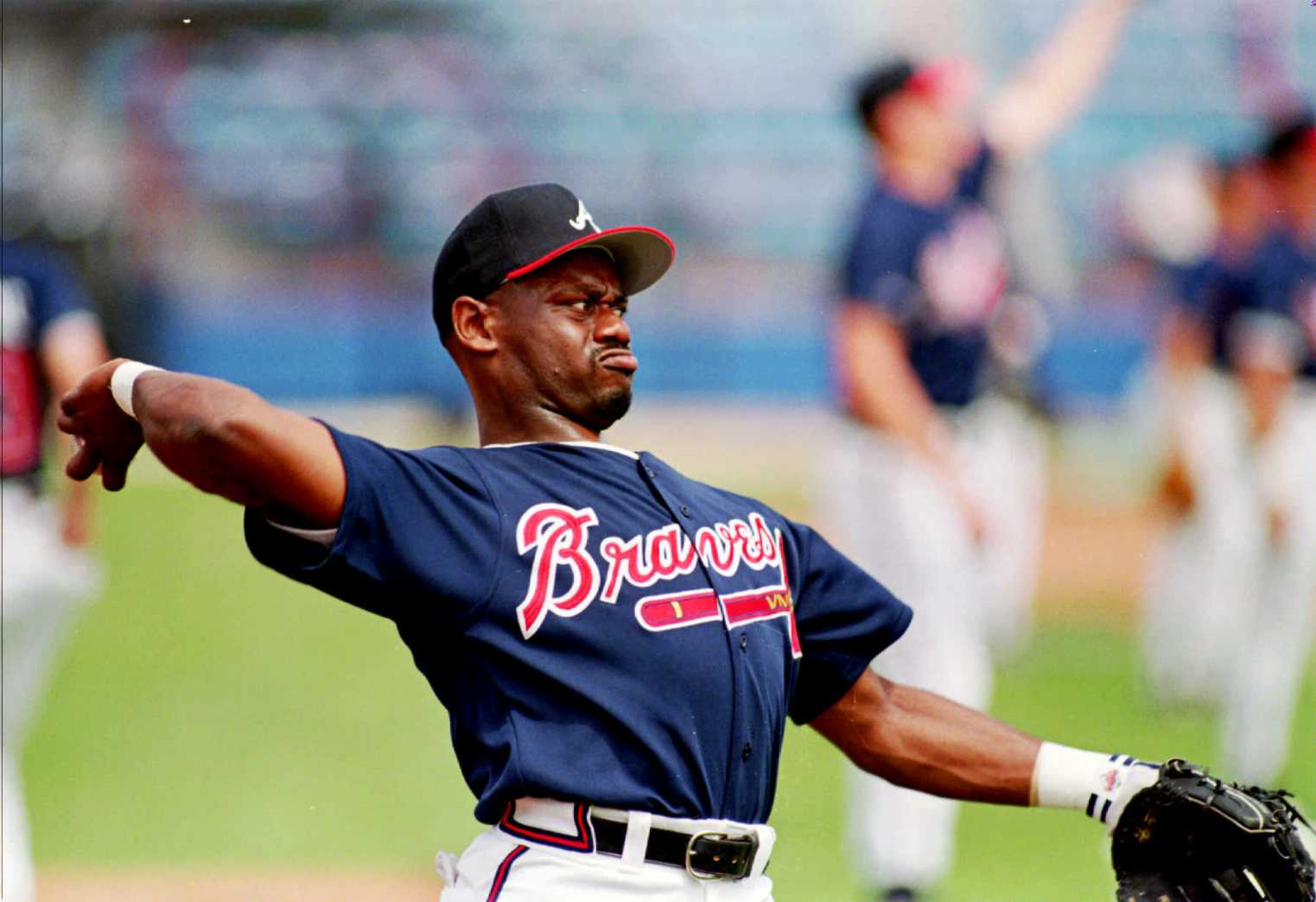 Marquis Grissom concentrates on a throw in spring training.